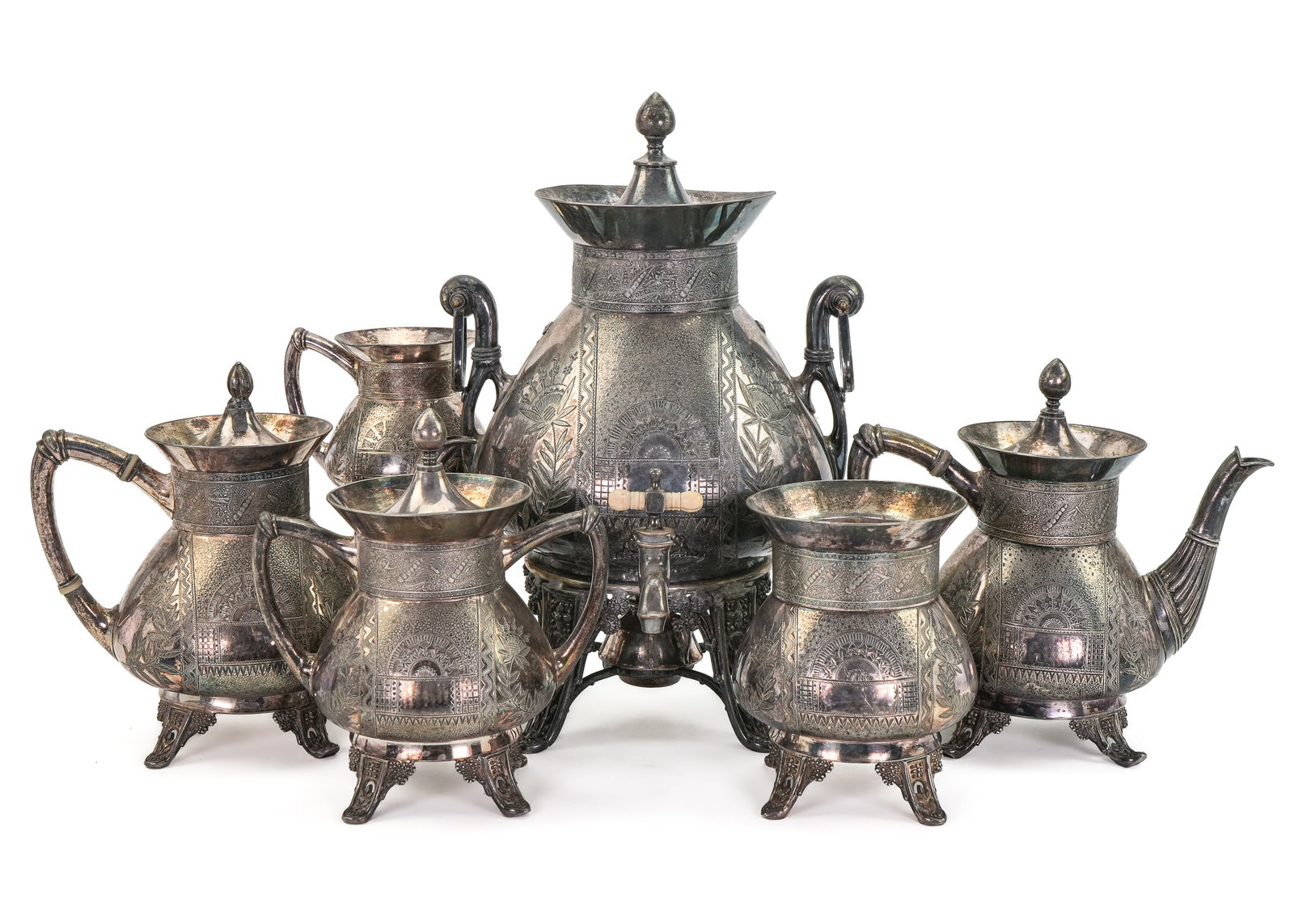 Meriden Victorian Silverplate Tea Set: Late 19th c. Meriden Victorian Aesthetic Movement silver plated tea service including hot water service urn, coffee pot, tea pot, creamer, sugar bowl, waste bowl. 5.25"-15.5"