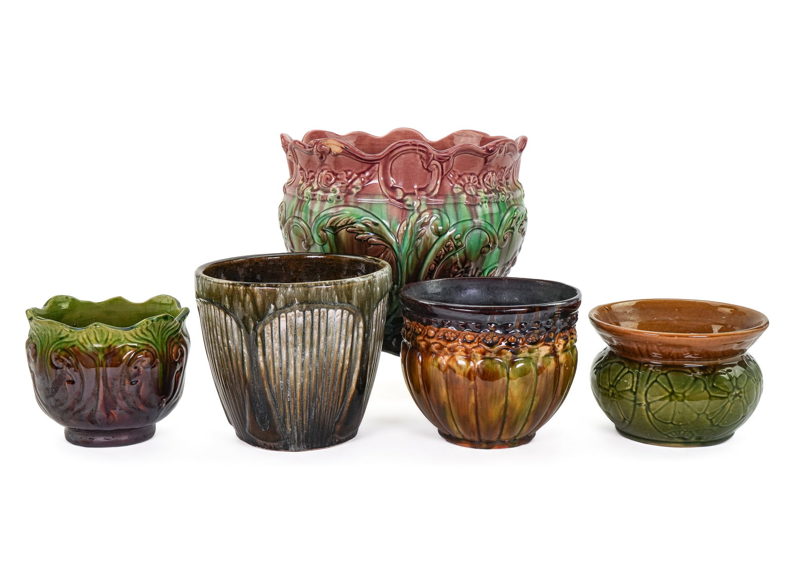 5 Majolica Art Pottery Jardiniere Planters: Group of 5 ca. 1900 majolica glazed art pottery planters in various embossed designs and mottled glazes. 5" -10"
