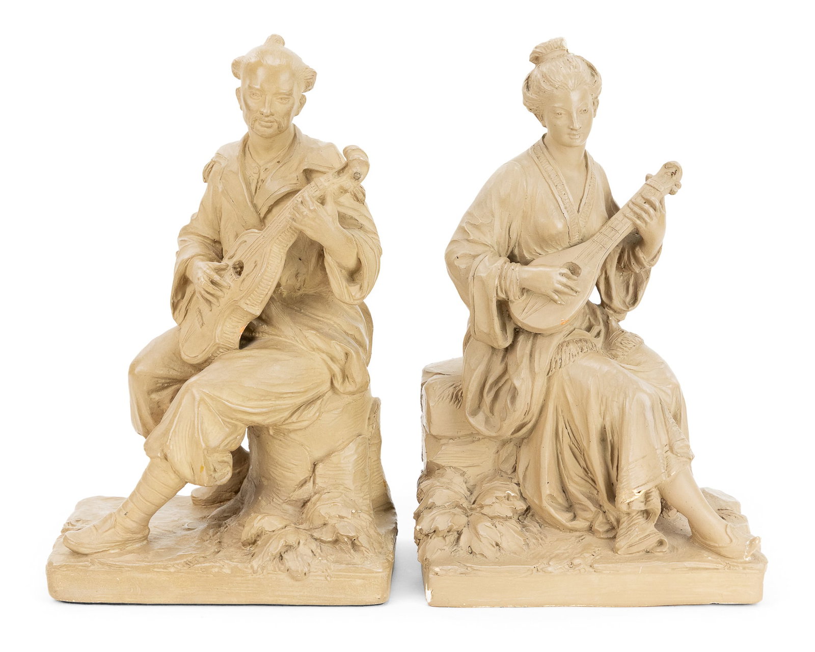 Pair of French Cabinet Figurines: Pair of French chalkware cabinet figures of seated musicians, one with small chip on base, 5" x 7" x 11 1/2"