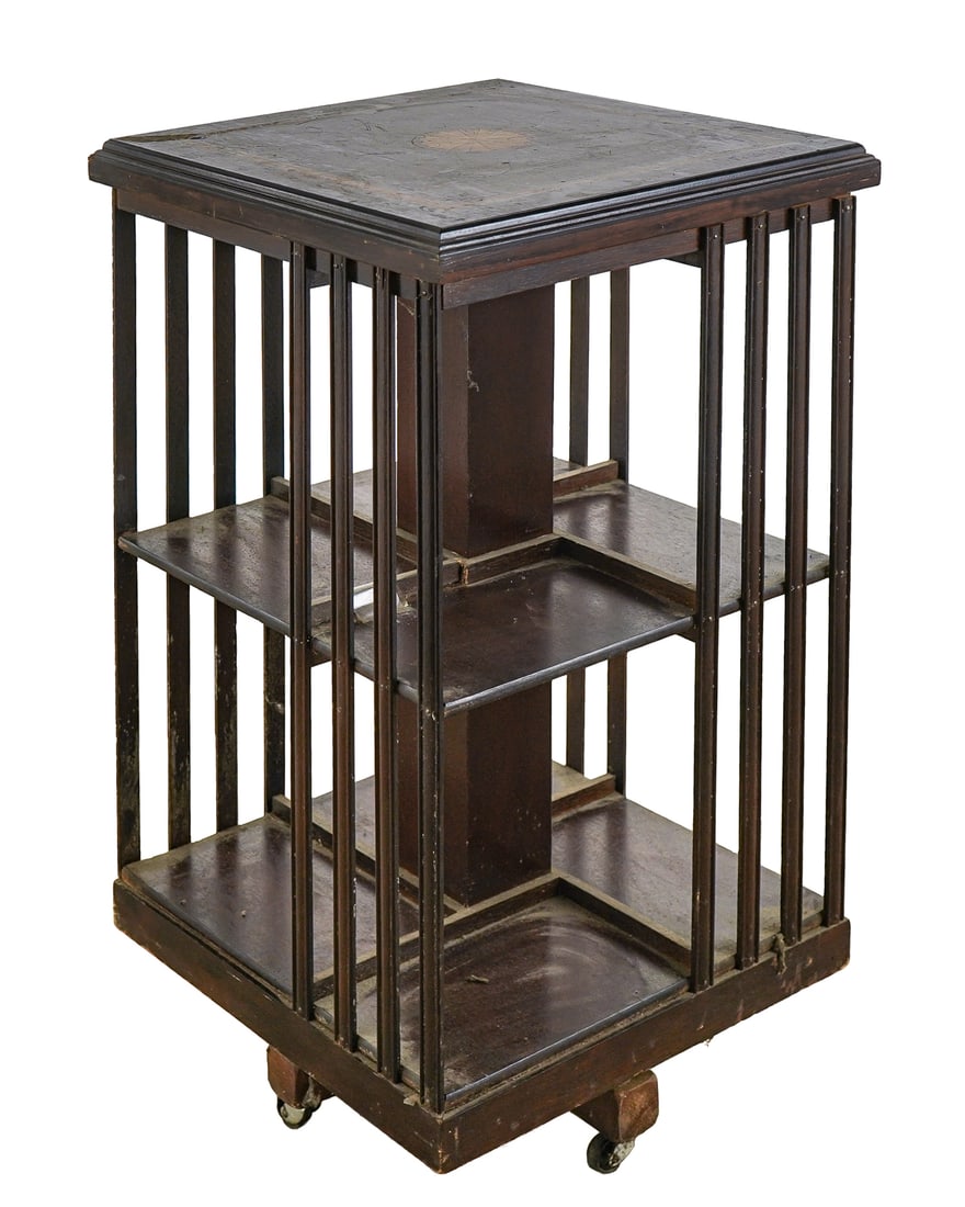 Mahogany Inlaid Revolving Bookcase: Ca. 1900 mahogany revolving bookcase with fan and banded inlaid top. 19" x 19" x 33". Some of the vertical slats have been tacked in place.