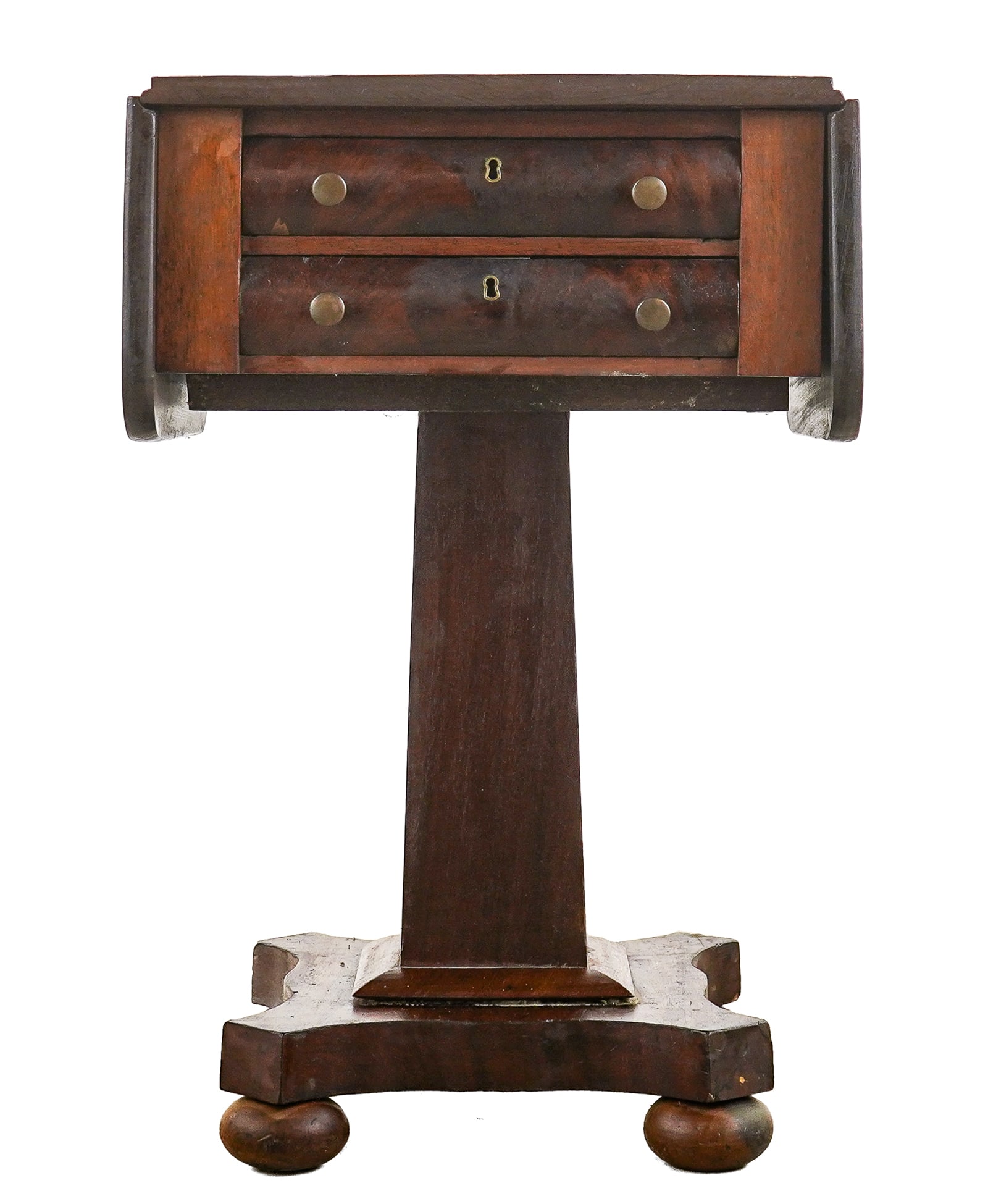 Ca. 1840 Mahogany 2 Drawer Work Table: Ca. 1840 American Empire mahogany 2 drawer drop leaf stand. Rolled drawer fronts, pedestal base, and 4 ball feet. Overall good condition. 18" x 17" x 28" h. Pine secondary.