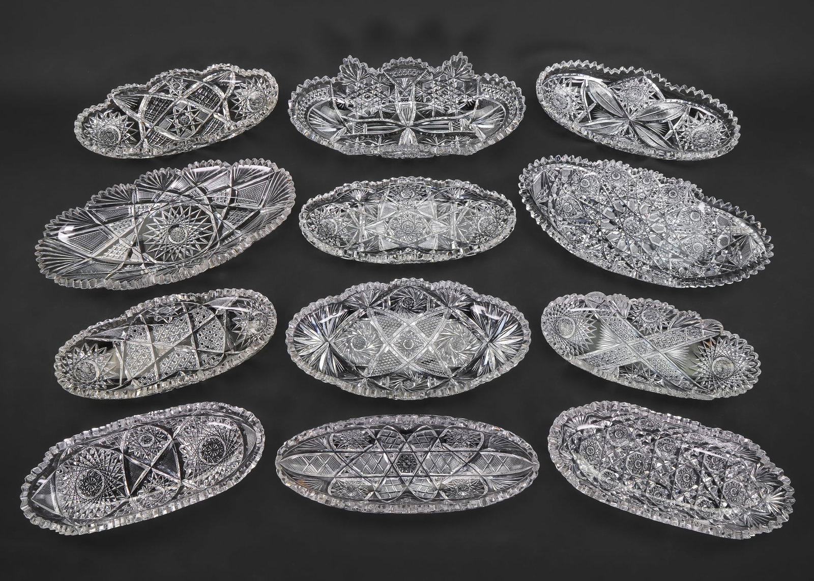 Collection of 12 ABCG Cut Glass Oblong Dishes: Group of 12 ABCG American Brilliant Period Cut Glass oblong pickle or relish dishes in various patterns, overall good condition, 11"-13"