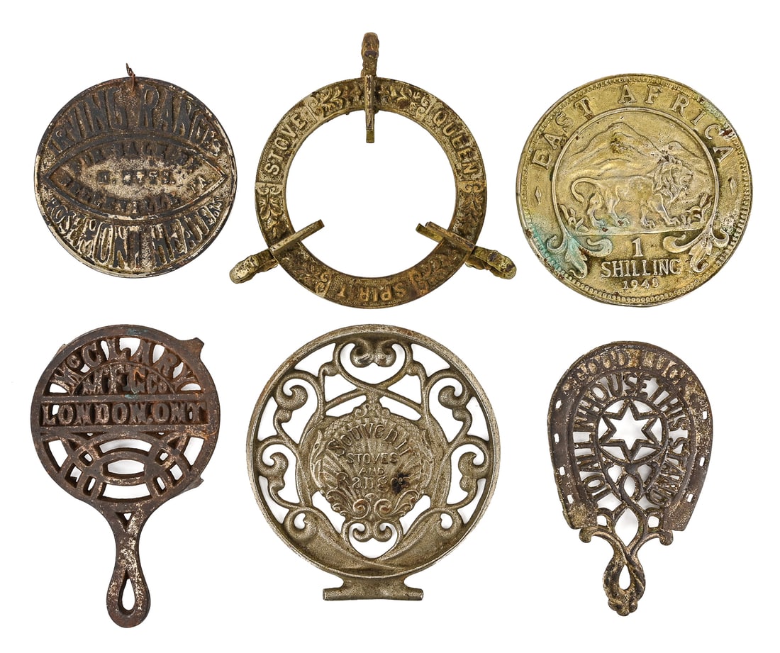 Monogrammed and Advertising Circular Trivets (6 pcs): Group of six circular trivets, including examples monogrammed and featuring advertising or commemorative designs such as Queen Stove Spirit, East Africa, London, Irving Ranges, Souvenir Stove and
