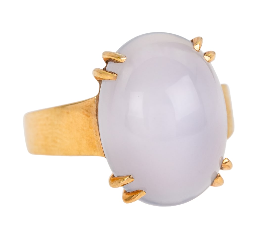 14k Chalcedony Ring: 14k yellow gold ring set with a oval cabochon cut 16mm x 12mm chalcedony. Ring size 6 1/2. 7.5 grams t.w.