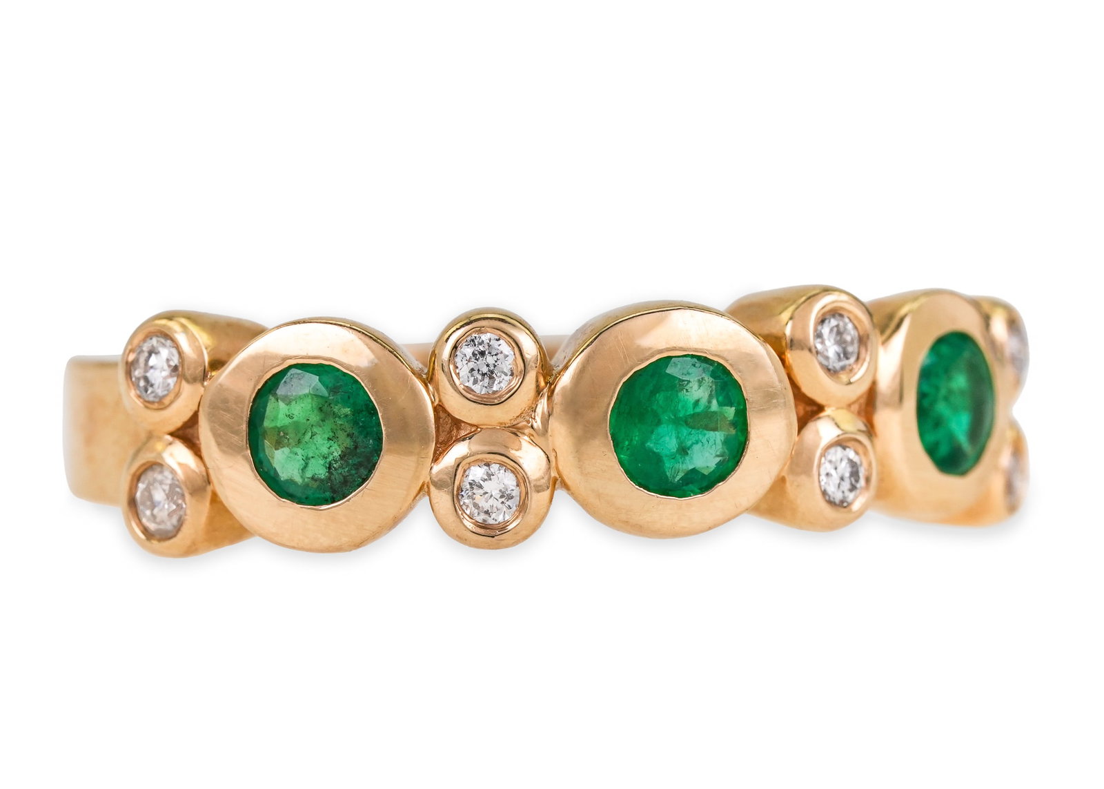 Emerald, Diamond, & 14k Bezel Ring: 14k yellow gold ring with 3 bezel set oval 3.5 mm emeralds, and 8 bezel set .02 round cut diamonds, ring size 7.