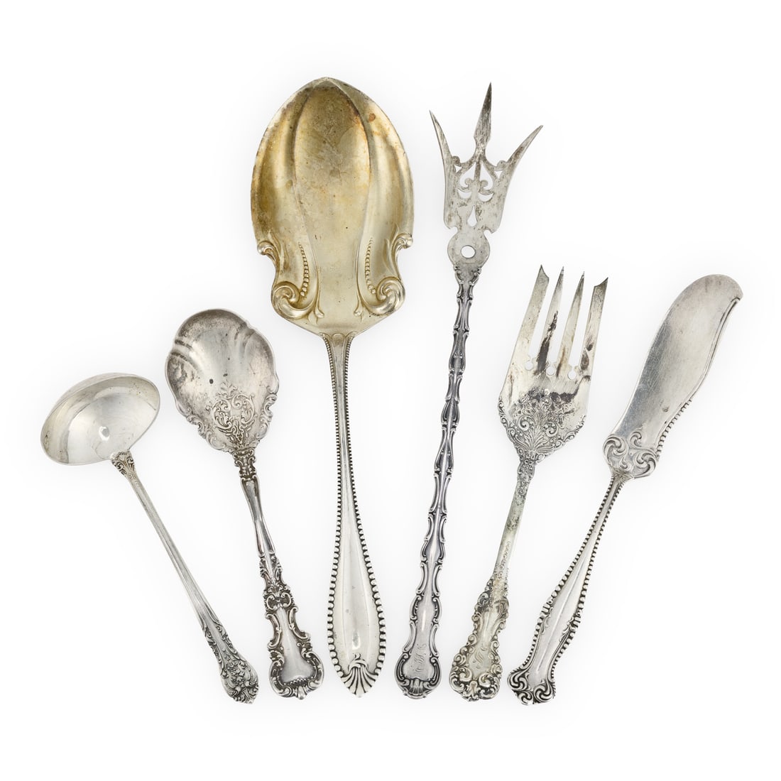 6 Ornate Victorian Sterling Serving Items: Group of 6 ornate Late Victorian sterling silver serving items including a Gorham "Strasbourg" lettuce fork, a Towle "Cordova" serving spoon, a Towle "Canterbury" butter knife, and others 5.5"-9" 8 oz