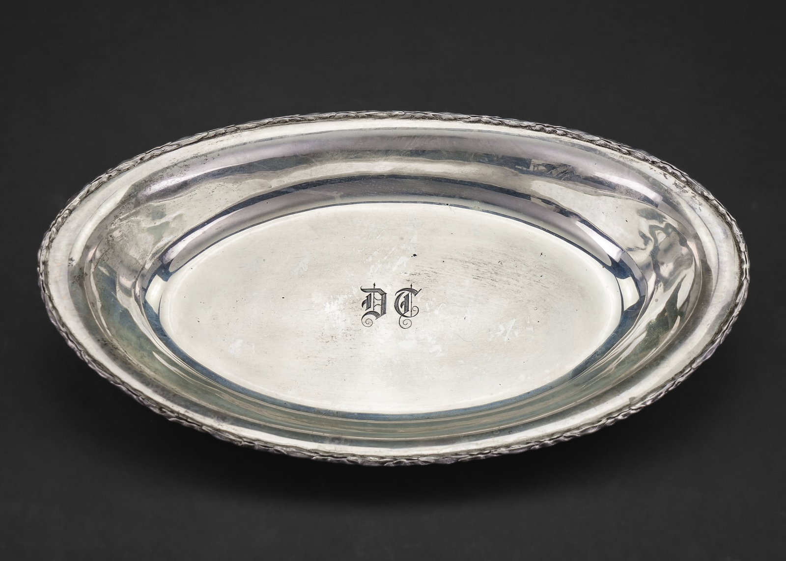 S. Kirk and Sons Sterling Oval Bread Tray: S. Kirk and Sons Baltimore sterling silver oval bread tray with subtle laurel edge, Gothic script monogram in center 1.75" x 10" x 6" 9.4 ozt.