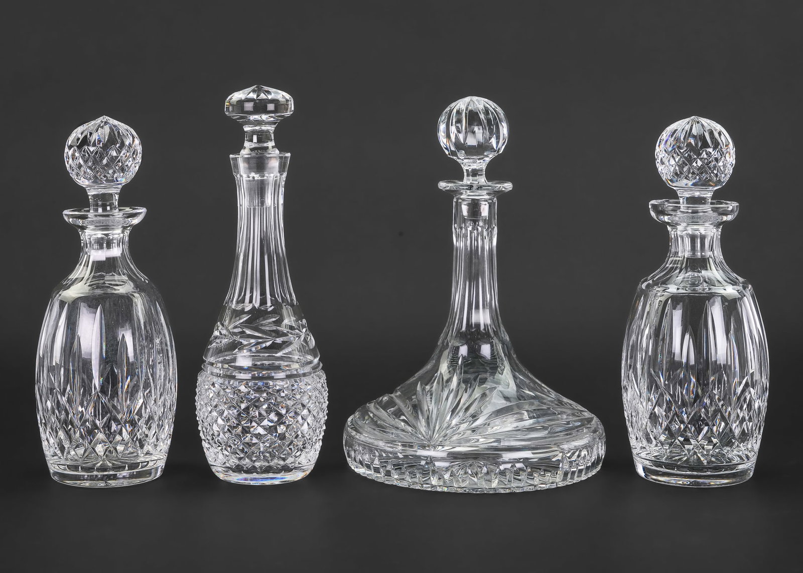 4 Waterford Irish Crystal Decanters: 4 Waterford Irish crystal decanters including tall Glandore pattern decanter, wide ships decanter, and a pair of Lismore decanters. ht. 11"-11.5"
