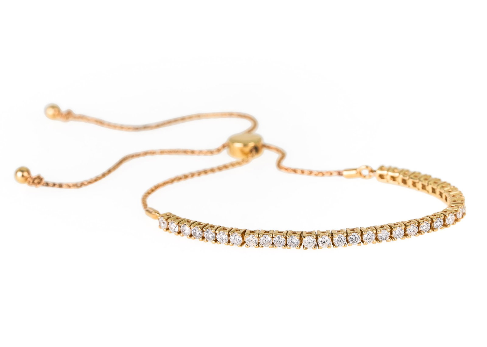 1.5 CT Diamond Bracelet: 14k yellow gold bracelet with 1.5 ct.t.w round cut diamonds. 33 .05 ct round cut linked diamonds with back chain having a double slide for length adjustment. 4.3 grams t.w.