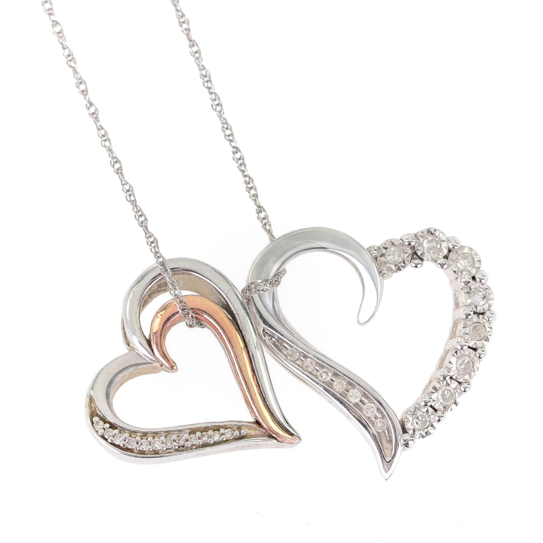 Diamond & Heart 10k Necklace: 10k white gold chain with 2 10k white gold heart slide pendants. Each set with small diamonds, and one with a rose gold section. 4.7 grams t.w.