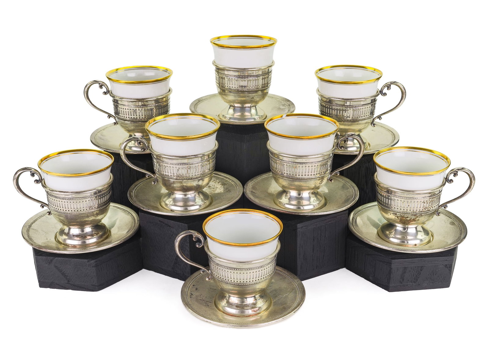 8 Fisher Sterling Demitasse Cups and Saucers: Set of 8 Fisher sterling silver demitasse cups and saucers having beaded and reticulated rims, and Hutschenreuther gold band porcelain liners, 3"-4" 15.4 ozt. -one porcelain liner cracked, otherwise o