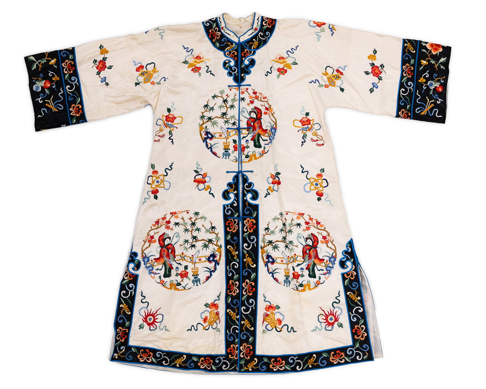 Early 20th c. Chinese Silk Embroidered Robe: Early 20th c. Chinese silk embroidered three-quarter length robe having scenic cartouches and blue trimmed black cuffs, cream ground, size "M", some staining to lining, overall very good condition.