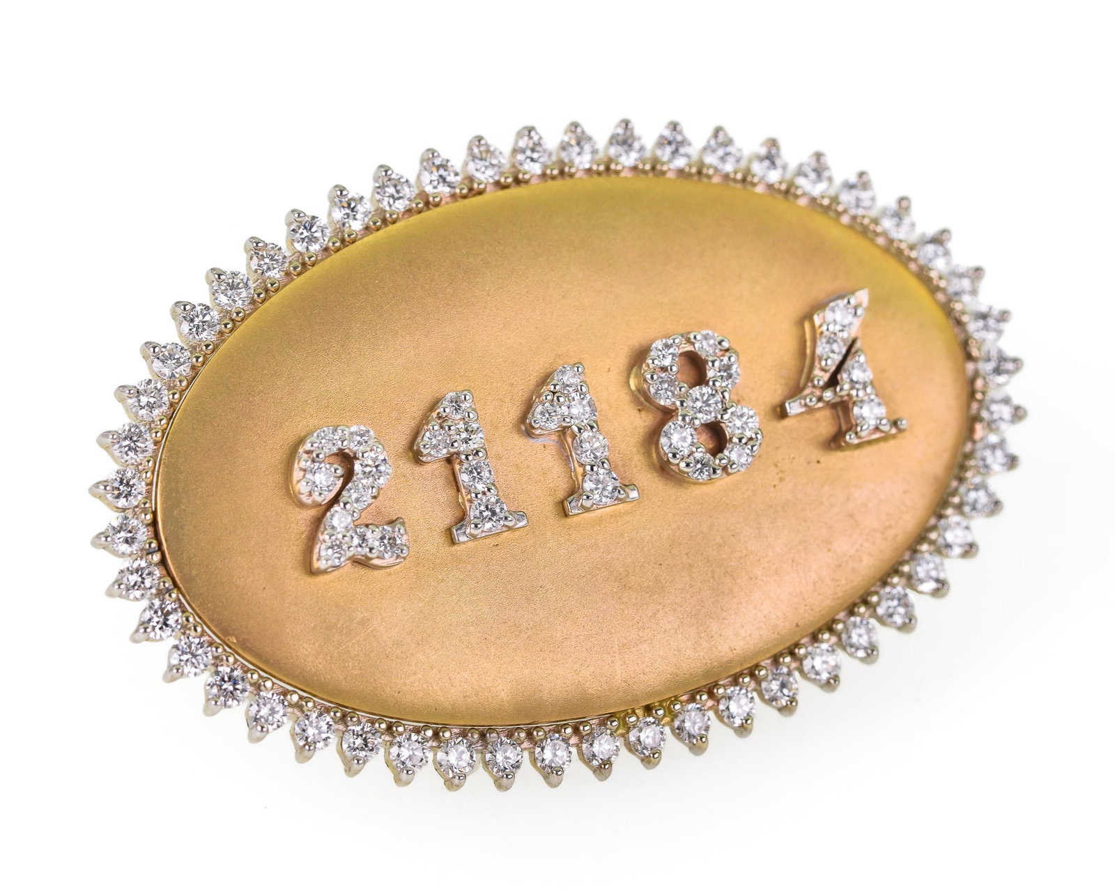 14k Yellow Gold & Diamond Oval Pin: 14k yellow gold oval brooch pin with 60 .01 ct diamond surround and the numbers "21184" on front set with approx. 30 diamonds. Approx. 1 ct t.w. diamonds. 1 1/2" long. 10.6 grams t.w.