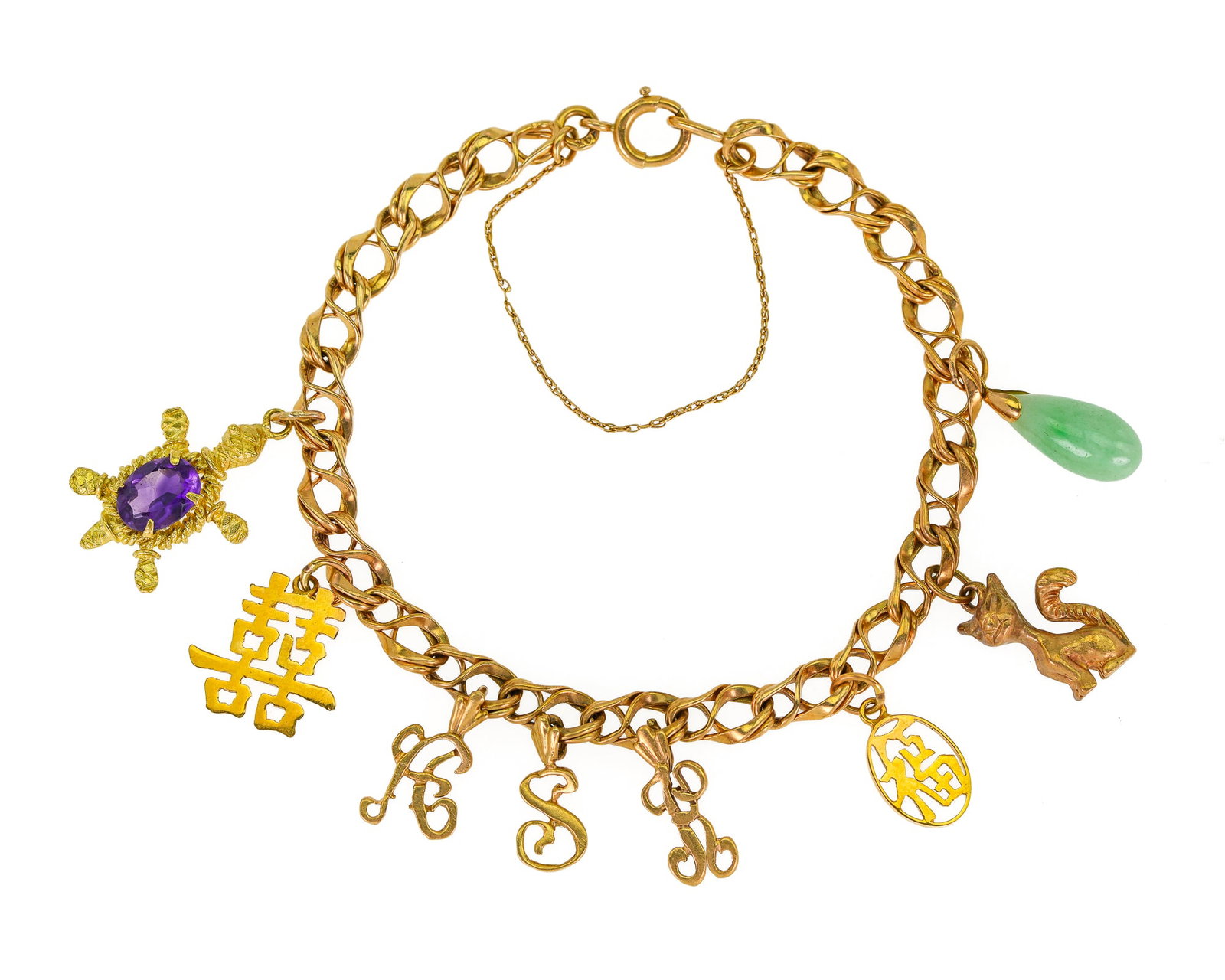 Tiffany 14k Yellow Gold Charm Bracelet: 14k yellow gold charm chain bracelet, marked Tiffany having charms - 18k y.g. turtle with amethyst back, fine jade oblong bead, 10k cat, 3- 14k flat letters, and a 14k Chinese character. 16.4 grams