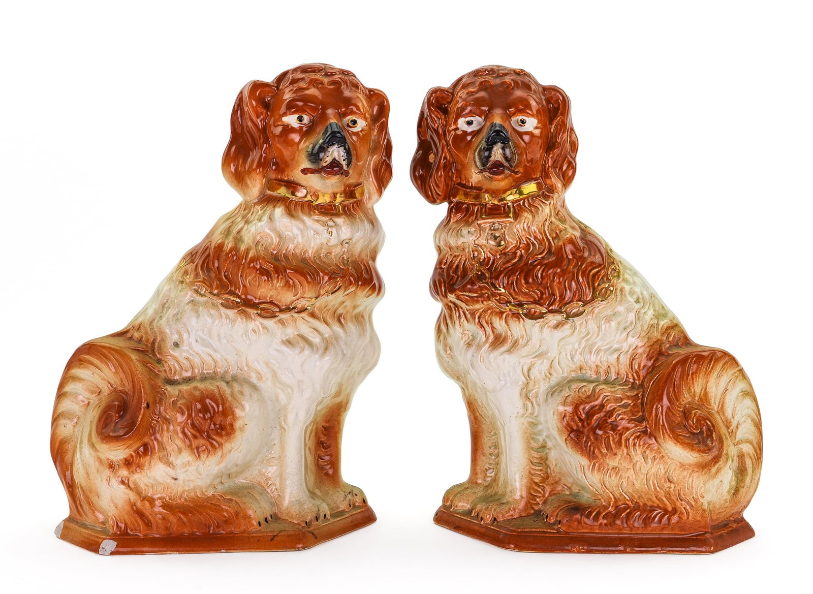 Pair of Staffordshire Spaniel Chain Dogs: Pair of 19th c. English Staffordshire pottery spaniel chain dog mantel figures having hand painted gilt accents 9" x 13" one has significant chip to base on reverse and minor chips on front, the