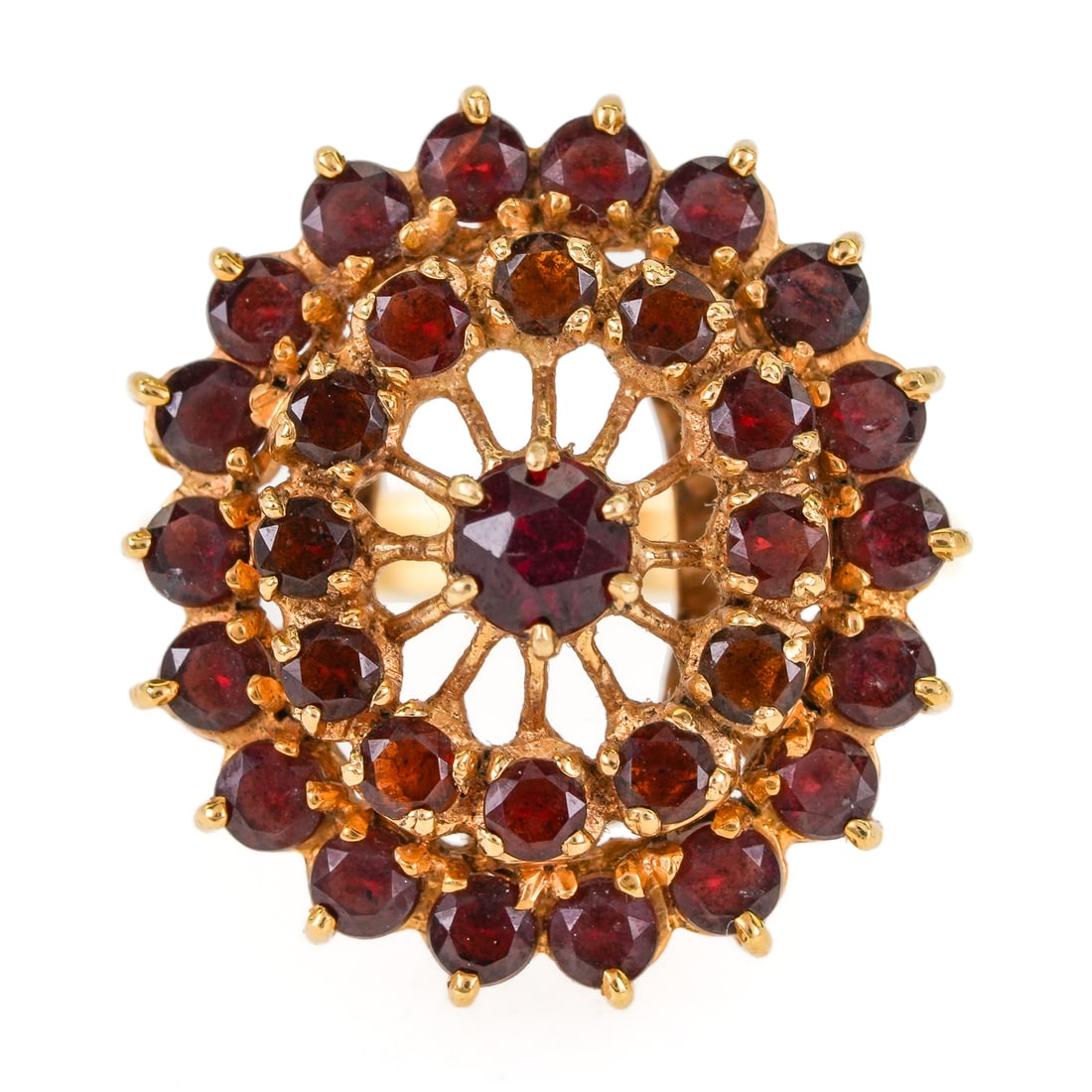 Garnet Ring & Earrings: 18k yellow gold ring with cake design having a center round cut .1 ct garnet and two circular surrounds of garnets, 3/4" diameter, ring size 7.5. With a pair of garnet earrings with cake design