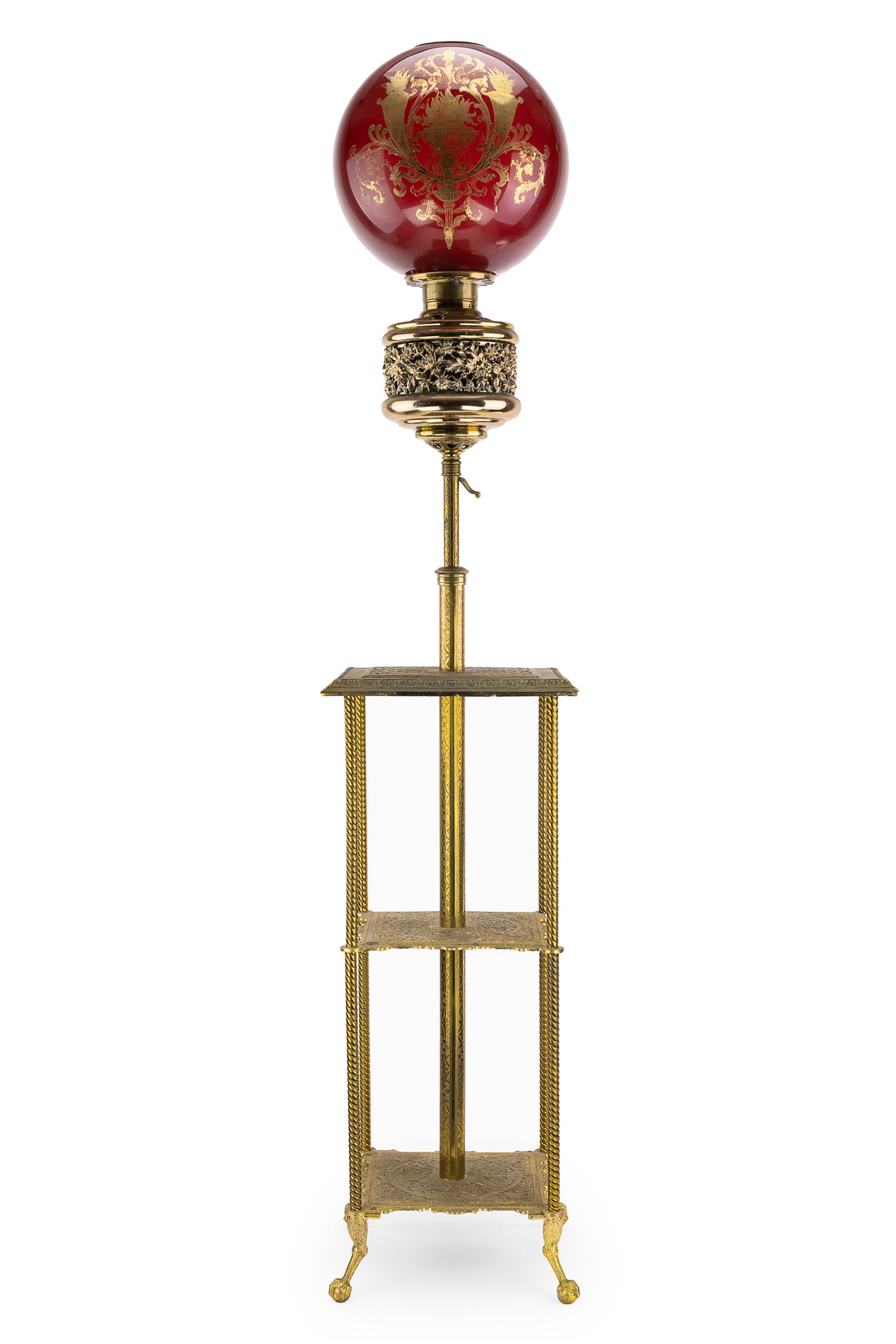 Victorian Gilt Brass Parlor Floor Lamp: The Parker Lamp" Victorian era gilt brass parlor floor lamp, original oil configuration, gilt decorated red globe, with chimney, overall ht 50", extends to 74