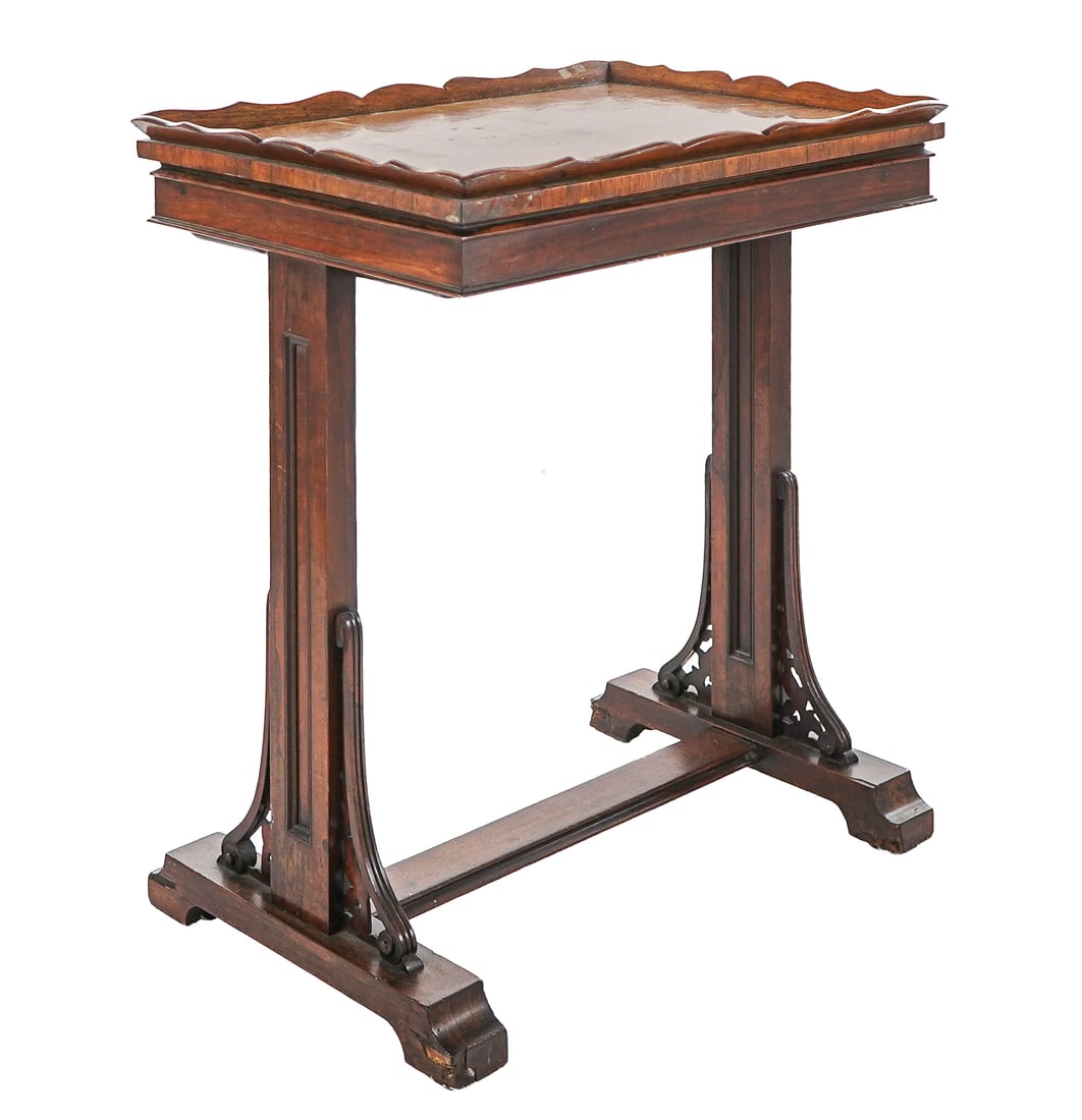 English Victorian Rosewood Tray Table: Mid 19thc English rosewood table with stretcher base, openwork ends, and scalloped edge tray top which lifts off to reveal compartment interior. 26" x 18" x 30" h.