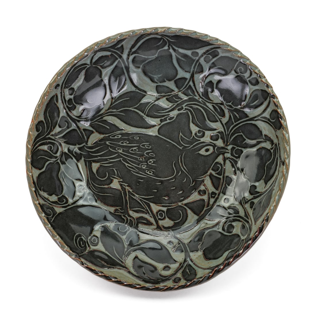 Shackleton Thomas Vermont Pottery Bowl: Miranda Thomas, Shackleton-Thomas, Bridgewater, Vermont artisanal pottery bowl having carved decoration of bird among pears with intertwining foliate decoration. Embossed mark on reverse. 2" x 10.25"