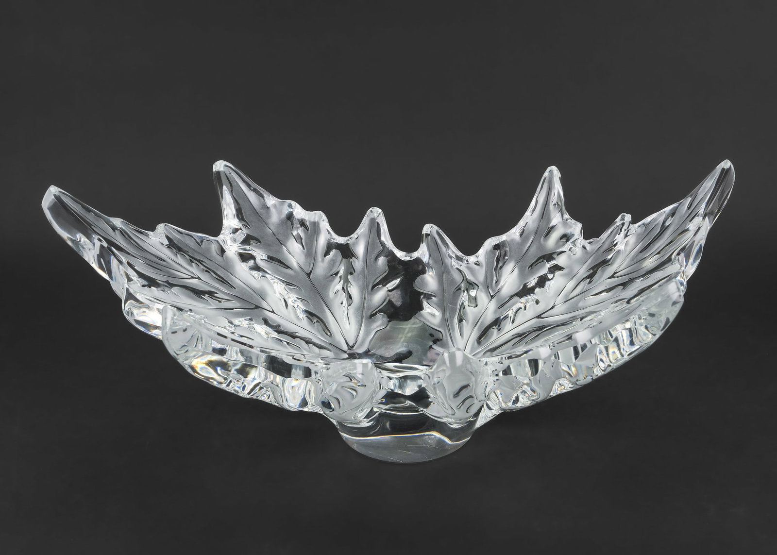 Lalique Champs Elysee Centerpiece Bowl: Lalique 'Champs Elysee' French crystal art glass centerpiece bowl having frosted intaglio foliate decoration. Signed on base 7.5" x 18" -as found, significant chip to one leaf tip.