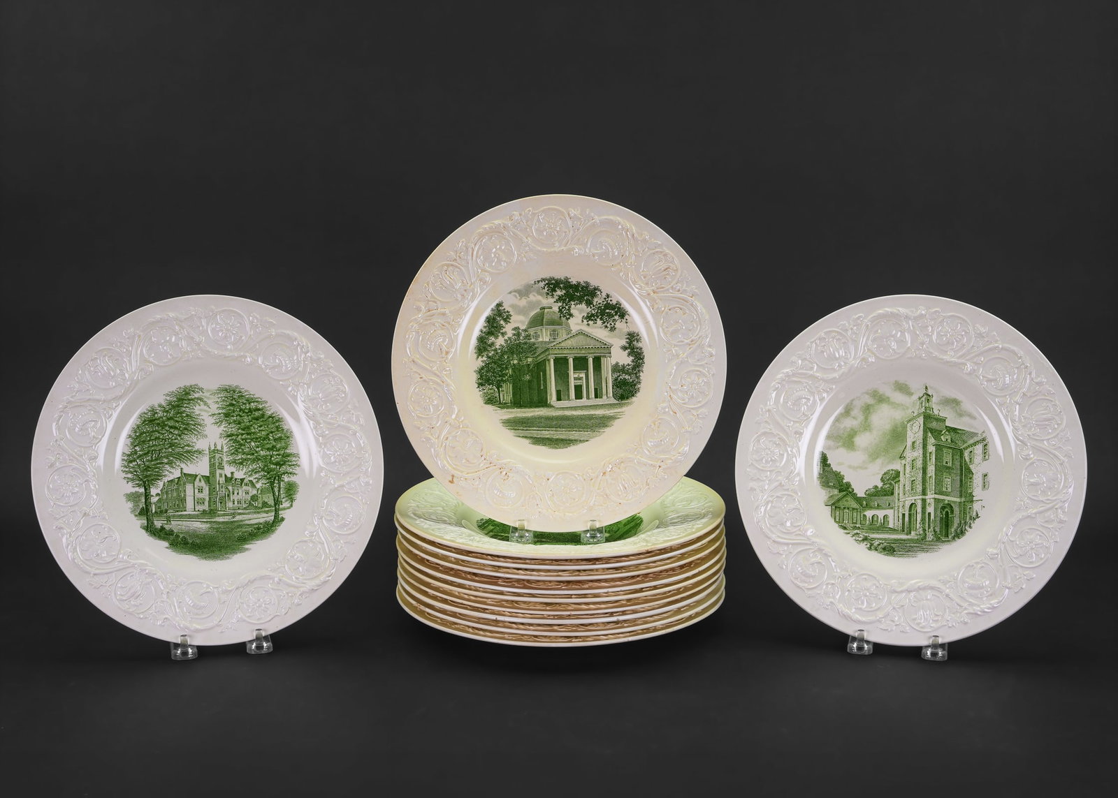 12 Wedgwood Smith College Dinner Plates: Set of 12 Wedgwood creamware porcelain dinner plates having embossed foliate border surrounding green transferware engraved center panel, each plate depicting a different historical view of the