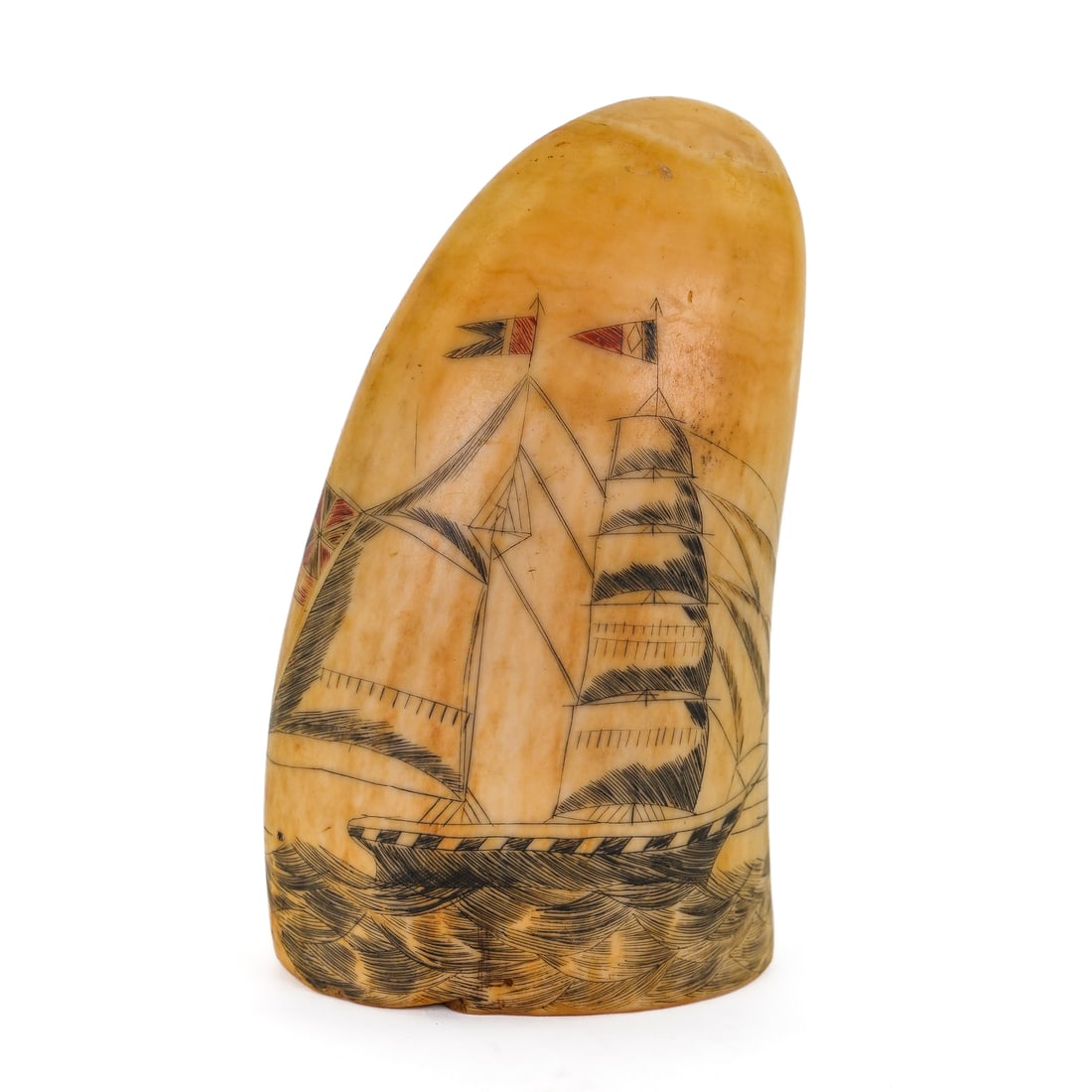19th Scrimshaw Tooth: 19th c scrimshaw tooth decorated with British schoner. Colored flags. 3 1/4" long.