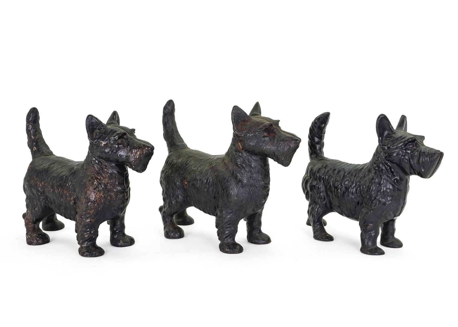 3 Cast Iron Scottie Dog Doorstops: 3 Victorian Scottie dog door stops. 10" x 9". Original black paint.