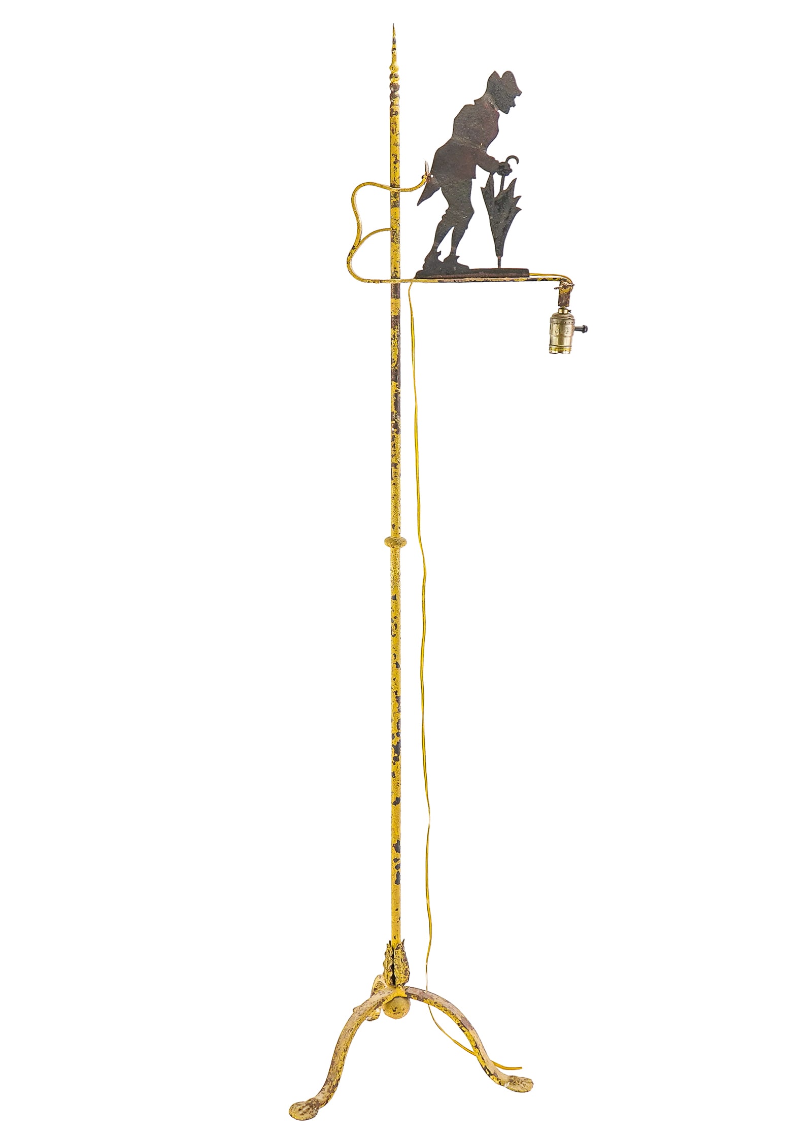Silhouette Man Bridge Lamp: Circa 1920's metal bridge lamp with cut sheet metal silhouette of man walking with umbrella. 59"h, 11" high man. Old yellow paint. Later wiring.