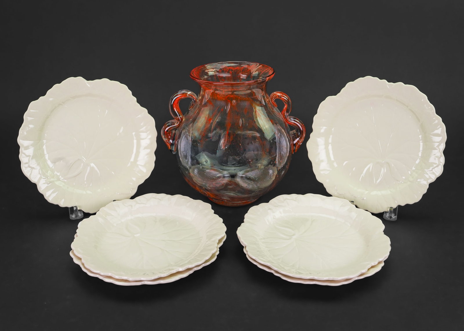 Wedgwood Creamware Plates, Art Glass Vase: Set of 6 Wedgwood leaf form embossed creamware ceramic salad plates, accompanied by a mid century orange and colorless bullicante Murano style double handled studio art glass vase, signed illegibly on