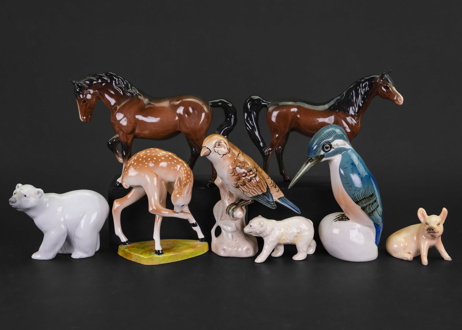 Beswick, Goebel, Royal Dux Animal Figures: Group of 8 porcelain animal figures including two Beswick horses, two Royal Dux birds, LLadro polar bear, Goebel polar bear and pig, Floral Staffordshire deer fawn ht. 3"-7"