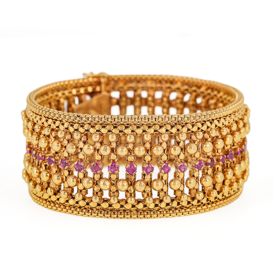 18k & Ruby Cuff Bracelet: Fine 18k yellow gold cuff bracelet with multiple bead and bar design each section with a .06 ct round cut ruby. 41 rubies, approximately 2.5 cts t.w. rubies. 99.83 grams t.w. 7 1/4" long, 1 1/4".