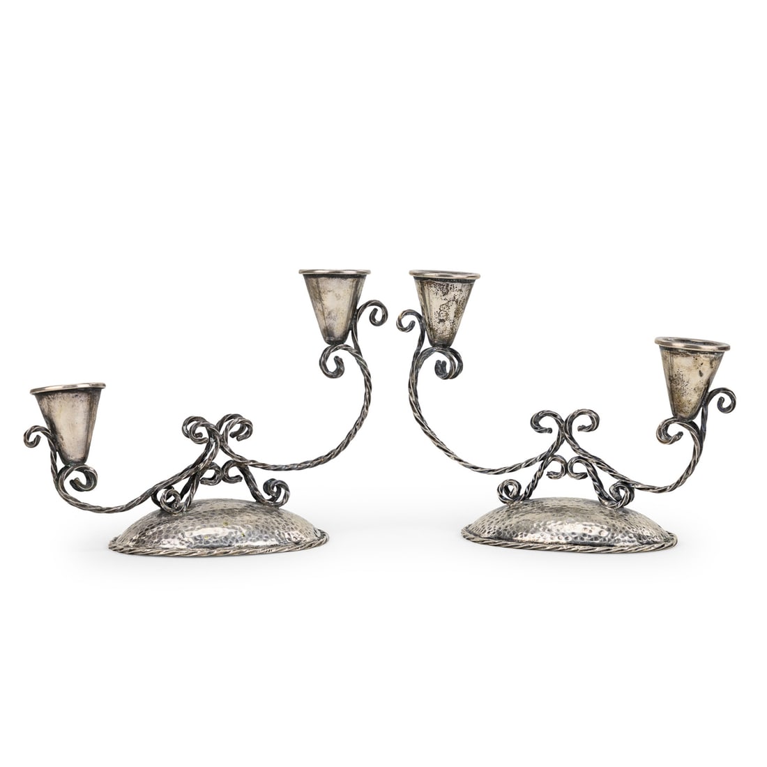 Pr. French Minerva Silver Candelabra: Pair of Mid Century French .950 Minerva silver double armed candelabra having twisted openwork arms and hand hammered bases 5.25" x 7" 11.7 ozt.