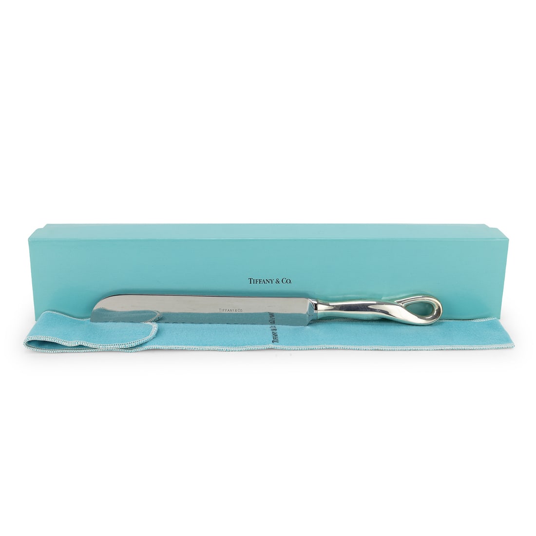 Tiffany Elsa Peretti Sterling Cake Knife: Contemporary Elsa Peretti for Tiffany and Co. modern design sterling handled serrated cake knife having stainless steel blade, with original felt storage bag and presentation box 11"