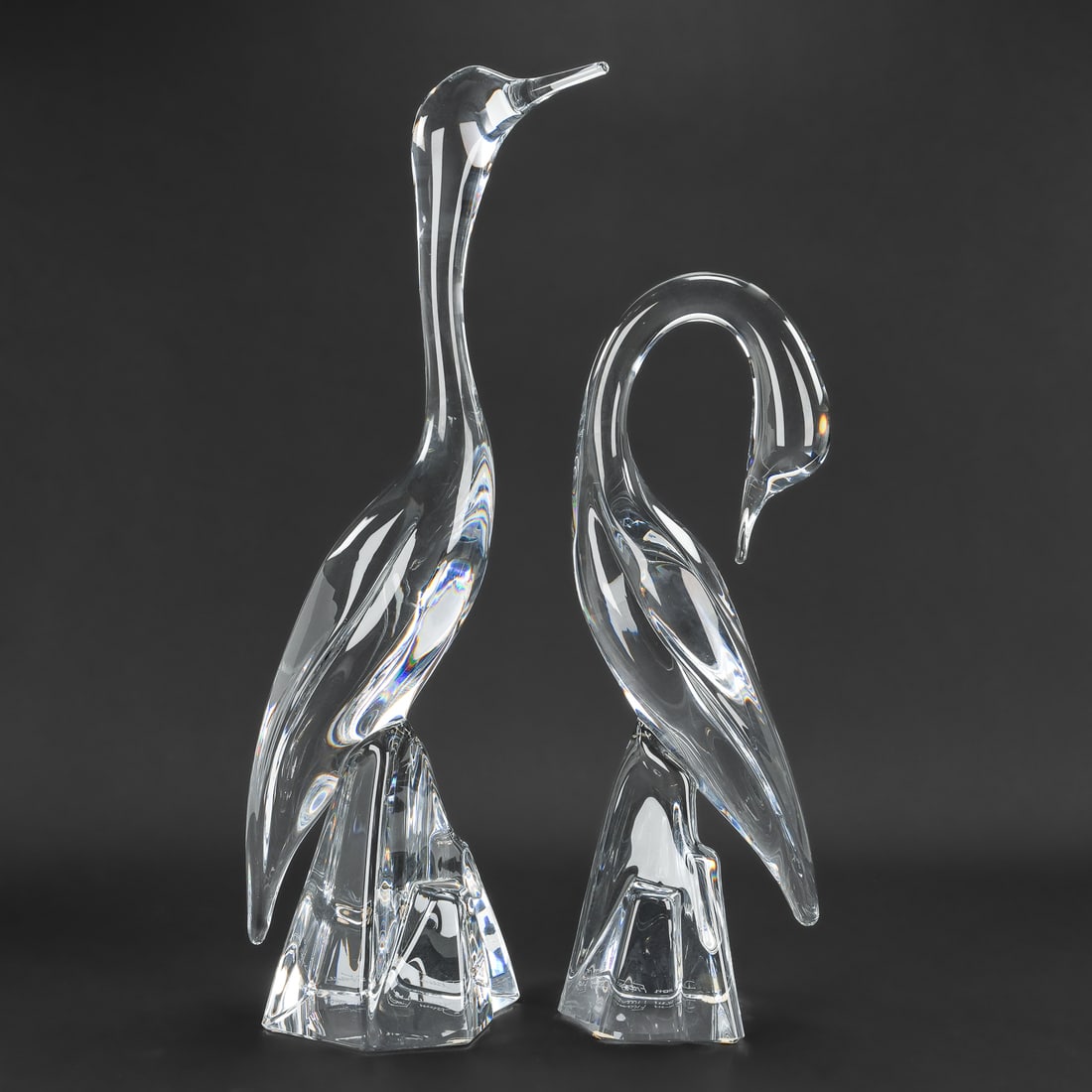 Pr. Daum French Crystal Heron Bird Figures: Pair of large contemporary Daum French crystal art glass heron bird figures in complementary poses, signed near base, overall excellent condition. ht. 14.5", 18"