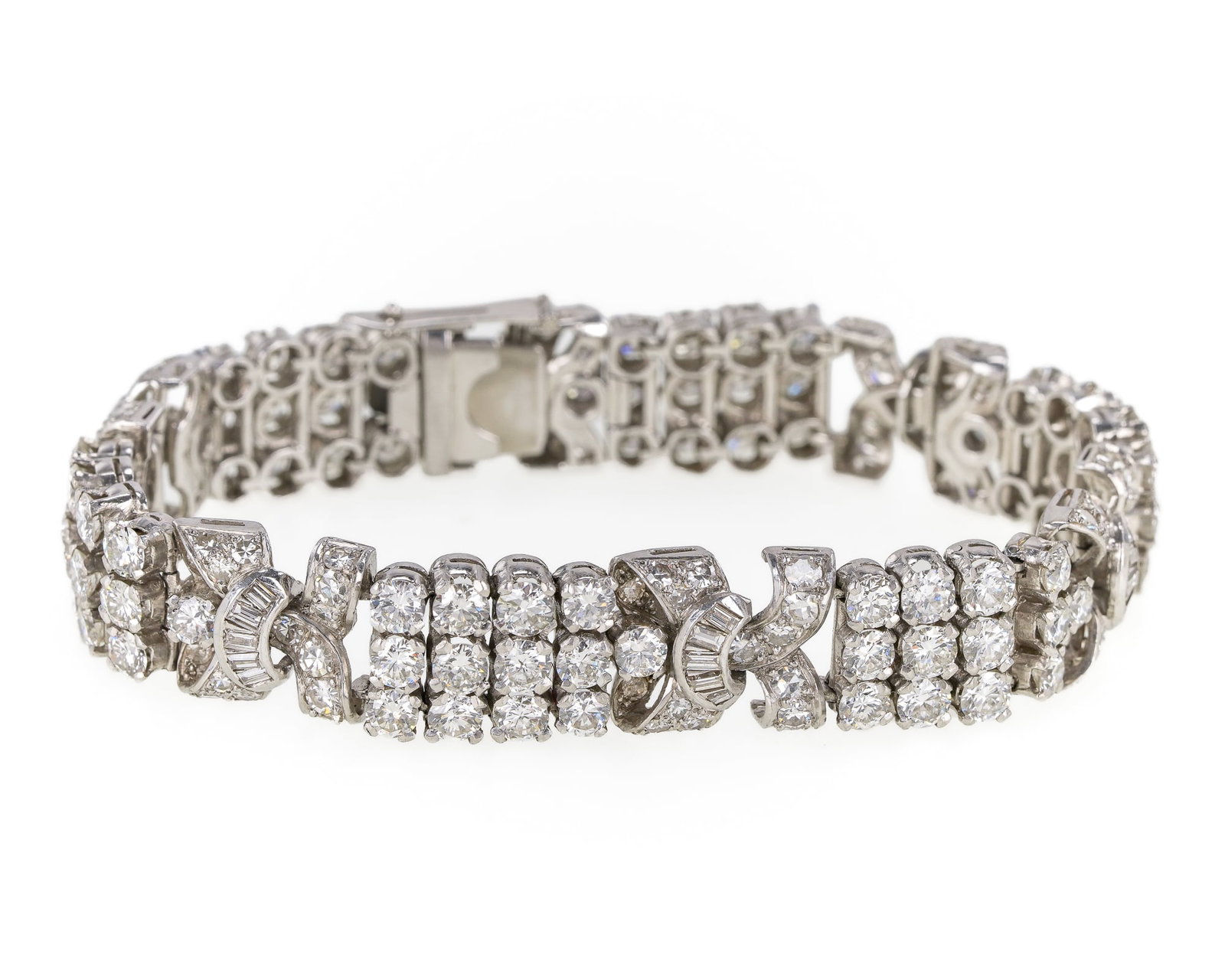 Edwardian 17 + Carat Dodd & Son London Platinum & Diamond Bracelet: Dodd & Son, London, Edwardian platinum and diamond bracelet. Bracelet set with six sections having 4 x 3 design (12) European round cut diamonds, .15 cts each. Connected with a bow tie design section