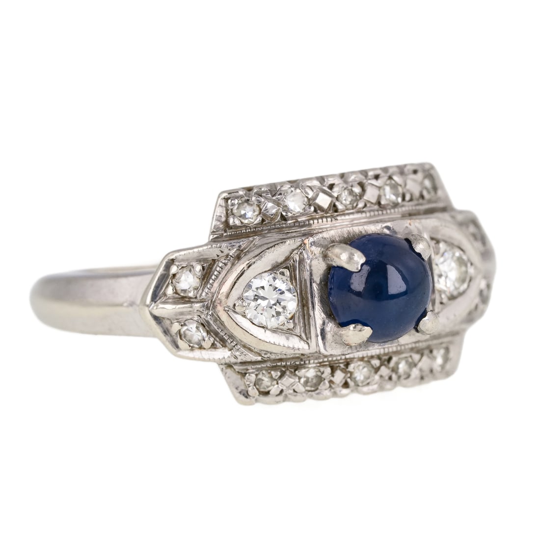 Art Deco Sapphire & Diamond Ring: 14k white gold Art Deco ring set with a center round cabochon natural sapphire, 4.7 mm x 3 mm, 3/4 ct. Set with 14 .01 ct diamonds and 2 round cut .05 ct diamonds. Ring size 5. 3.6 grams t.w.