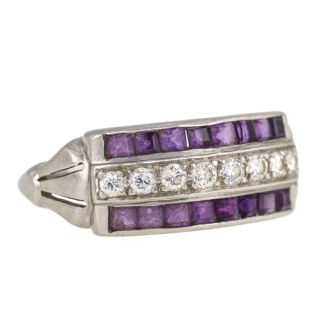 Art Deco Platinum, Diamond, & Amethyst Ring: Art Deco platinum ring set with a center row of 8 .05 ct round cut diamonds flanked on each side by a channel set row of baguette cut .05 ct amethysts. .4 ct t.w. diamonds. Ring size 5. 5.84 grams