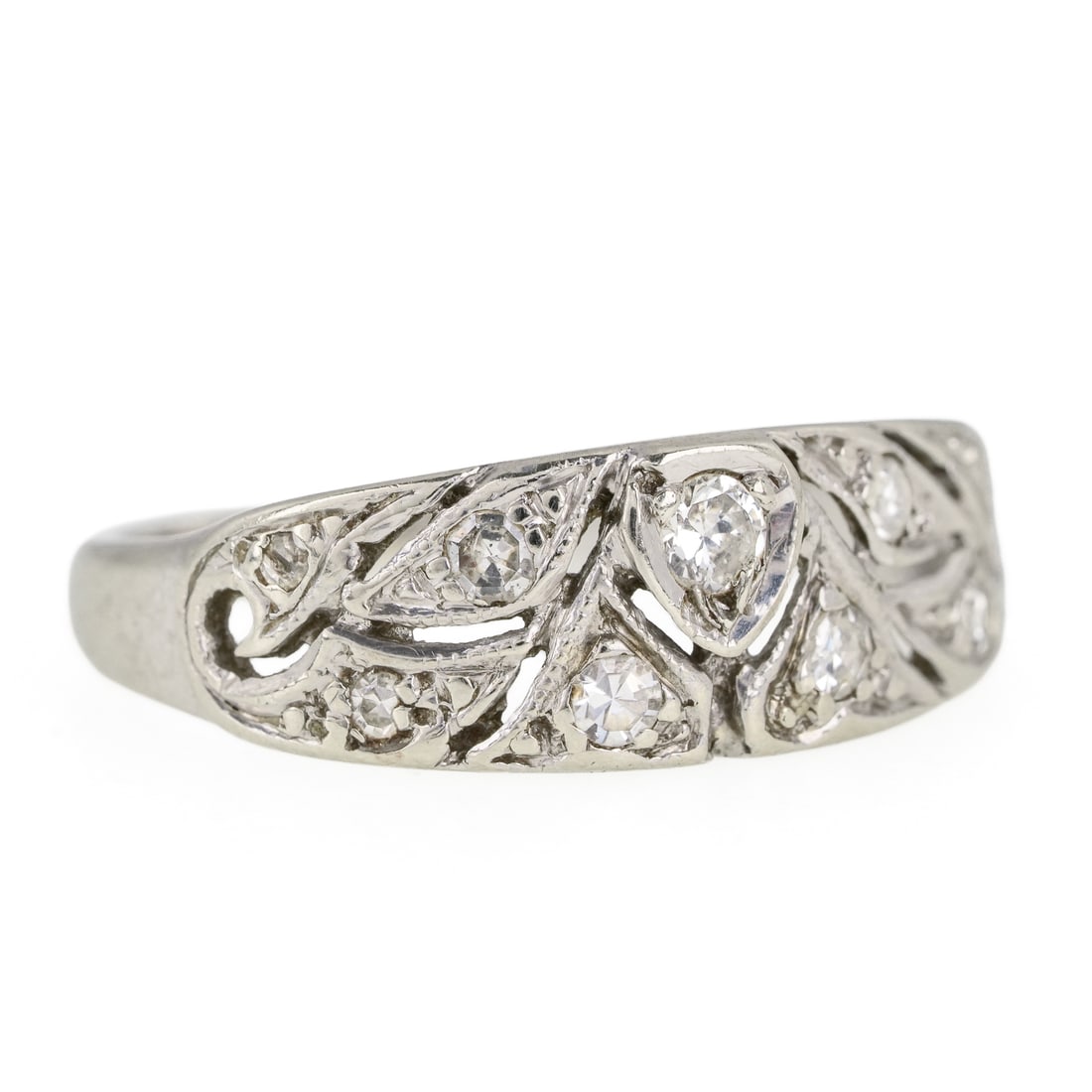 Art Deco 14k Diamond Ring: Art Deco 14k open work white gold ring set with center .1 ct European rd cut diamond, 2 - .04 ct diamonds, and 6 .02 ct diamonds. Ring size 6. 2.65 grams t.w.