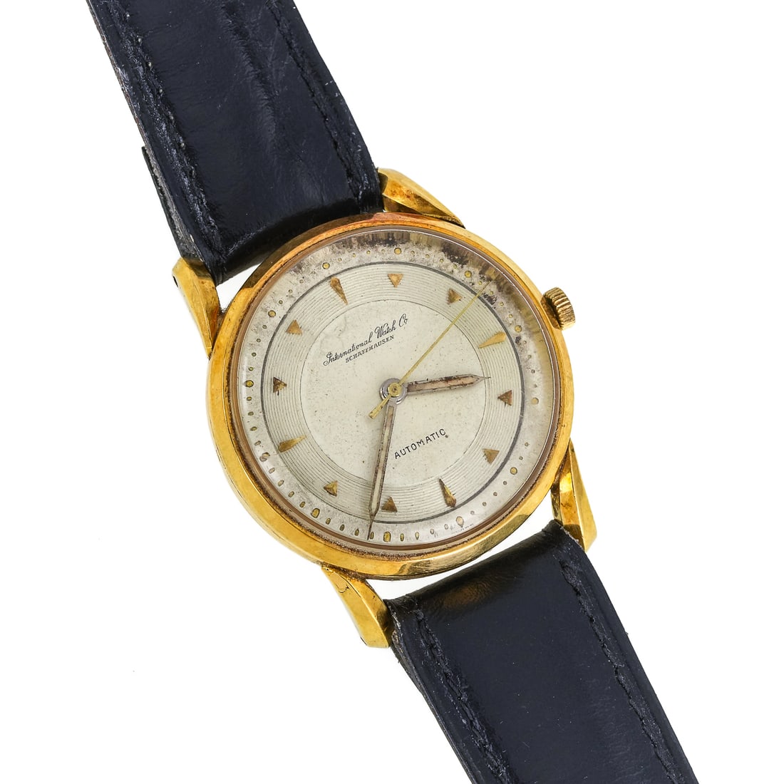 International Watch Co. Schaffhausen 18k Gold Men's Watch: IWC vintage men's International Watch Co 18 karat yellow gold Schaffhausen automatic movement wristwatch 35mm Switzerland. Two tone silver dial, gold hash marks on hours, later leather band. Running