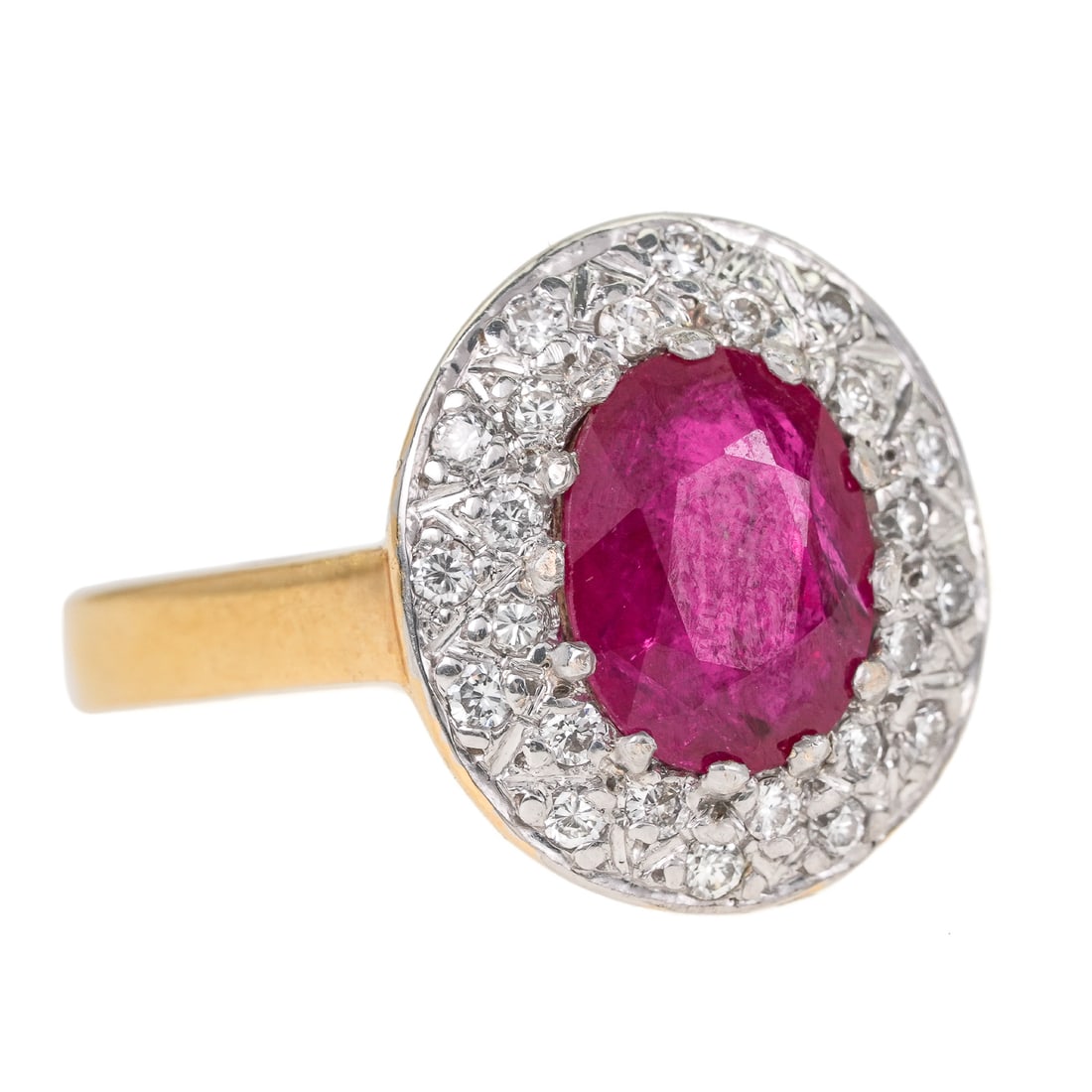 2 CT Natural Ruby & Diamond Ring: 14k yellow gold ring with a oval 2 ct natural ruby set with 30 small diamonds in surround, approx. .50 cts.t.w. Ring size 7. 5.6 grams t.w.