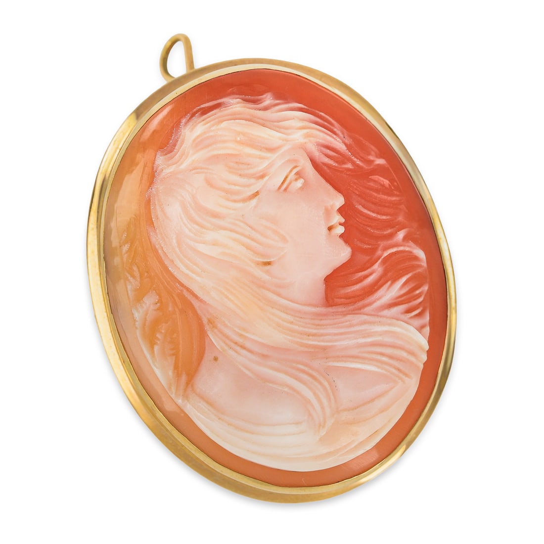 18k Cameo Brooch: Victorian 18k yellow gold oval cameo brooch pin with portrait of a woman with windswept hair. 1 3/8" long. 6.75 grams t.w.