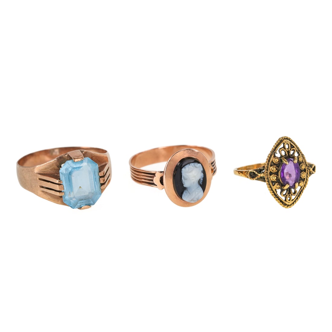 3 Victorian Rings: 3 Victorian rings including a 10k yellow gold cameo ring size 7. 14k yellow gold ring set with a center oval amethyst ring size 5. 10k yellow gold ring set with oval blue glass center, ring size 8.5. 