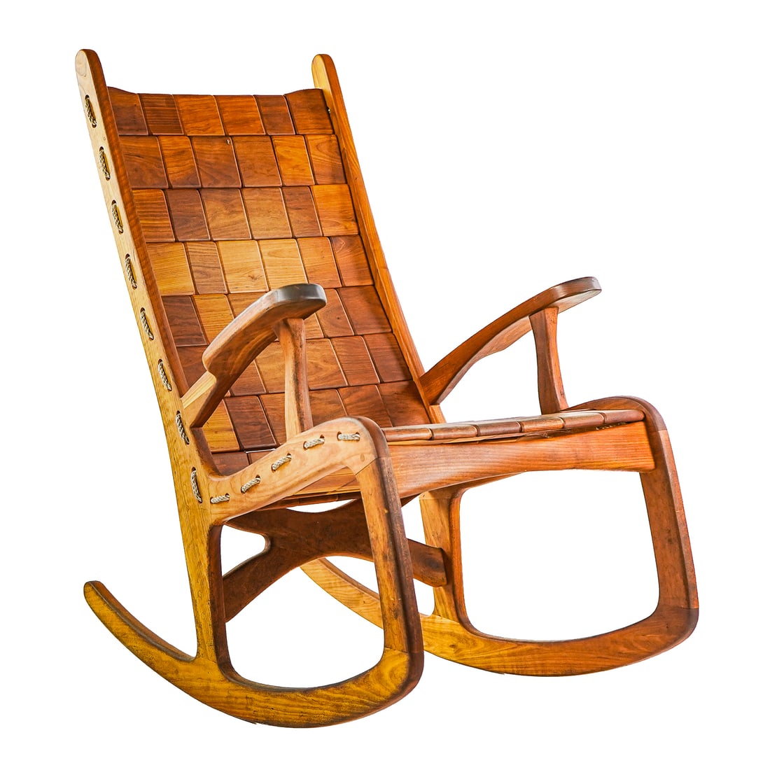 Vermont Cherry Folk Rocker: Vermont Folk rocker designed by Jim Geier Cherry with nylon rope - in good overall condition- natural patina from reasonable use 41.5 x 20.5 x 38.5"