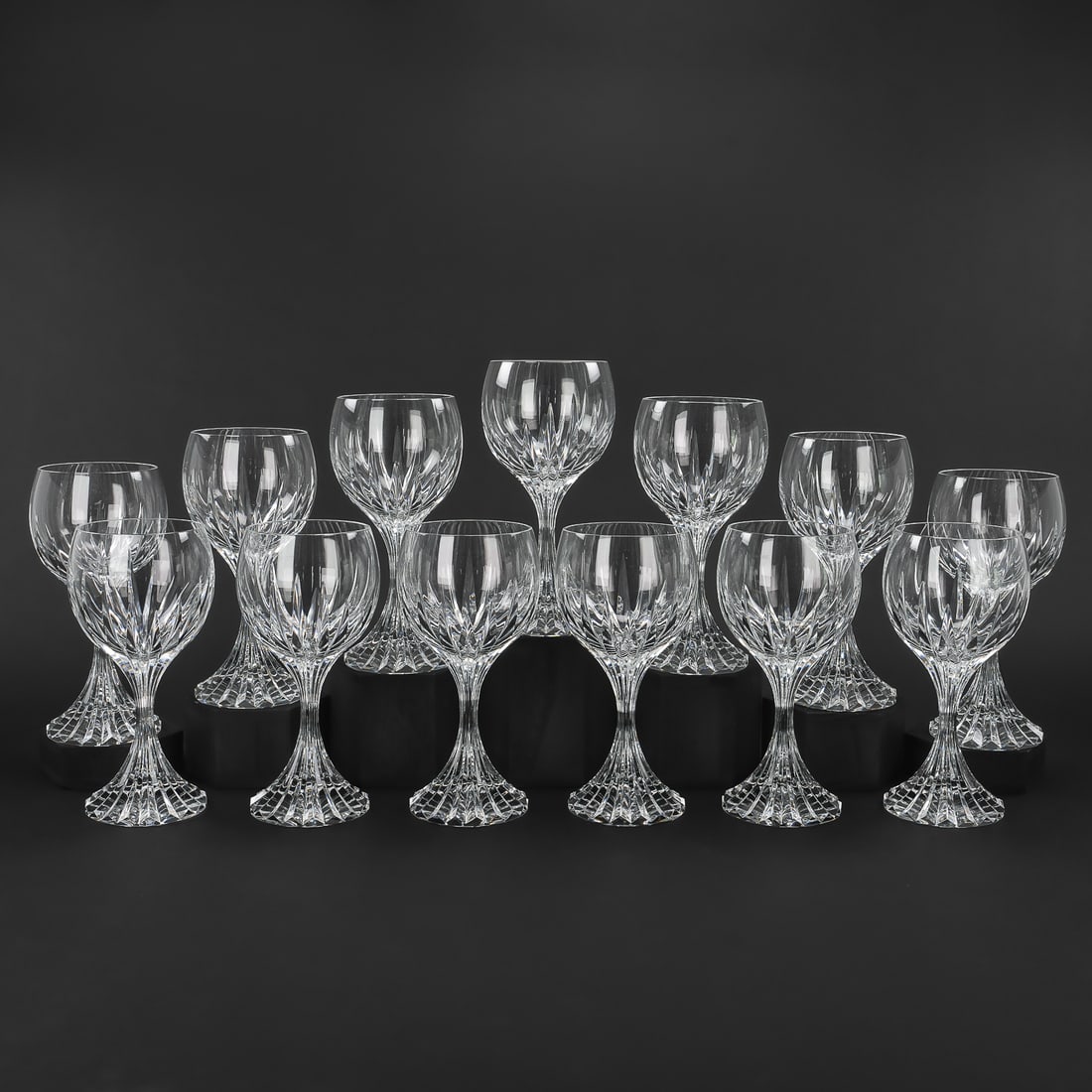16 Baccarat Massena White Wine Goblets: Set of 13 Baccarat "Massena" pattern signed French crystal hock or chardonnay large goblets with solid ridged bases, overall excellent condition. 7.5"