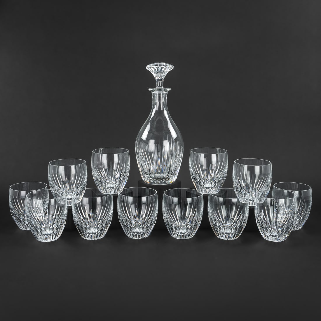 Baccarat Massena Decanter, Rocks Glasses: Set of 12 Baccarat "Massena" pattern signed French crystal rocks glasses accompanied by matching liquor decanter, overall excellent condition. 4"-10.75"