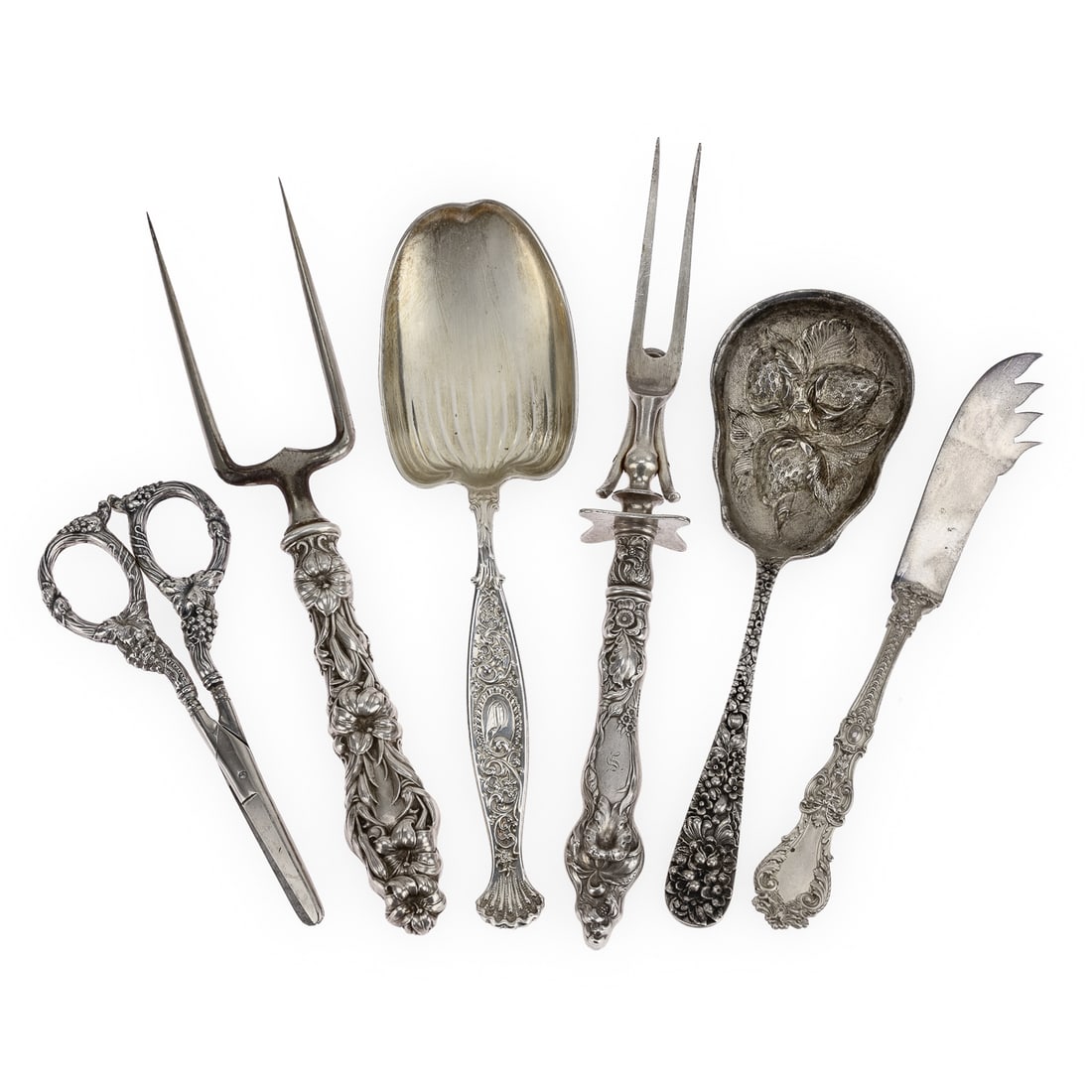 6 pcs. Ornate Sterling Silver Serving Flatware: Group of 6 pcs. of ornate sterling silver serving flatware including a Stieff 'Rose" pattern berry spoon with ornate repousse bowl, Gorham "Henry II" sterling butter knife, Whiting "Hyperion", a Whiti
