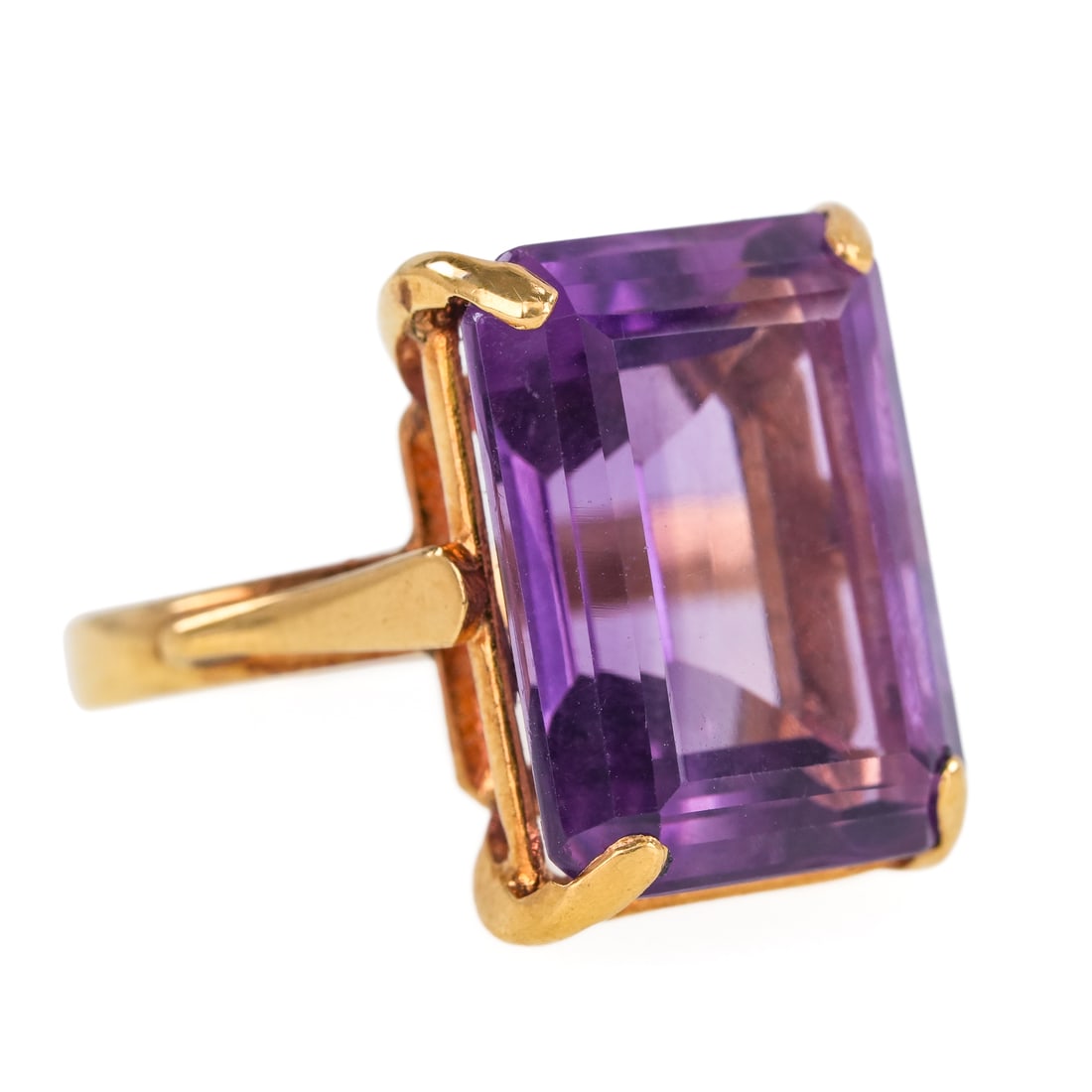 10 CT Amethyst Ring: 14k yellow gold ring set with a emerald cut 10 carat aquamarine, 16mm x 12mm x 8mm. Ring size 6.