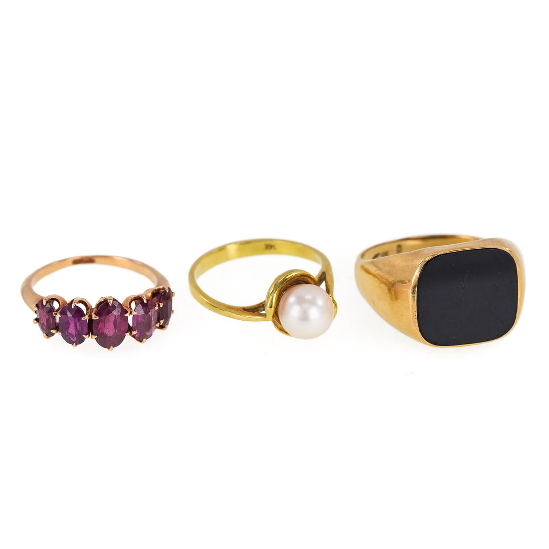 3 Yellow Gold Rings: A group of 3 yellow gold rings including a 10k men's ring with onyx panel, size 9.5. 14k ring with 8 mm pearl, size 7. 10k ring with 5 oval cut amethyst, size 6.5. 10 grams t.w.