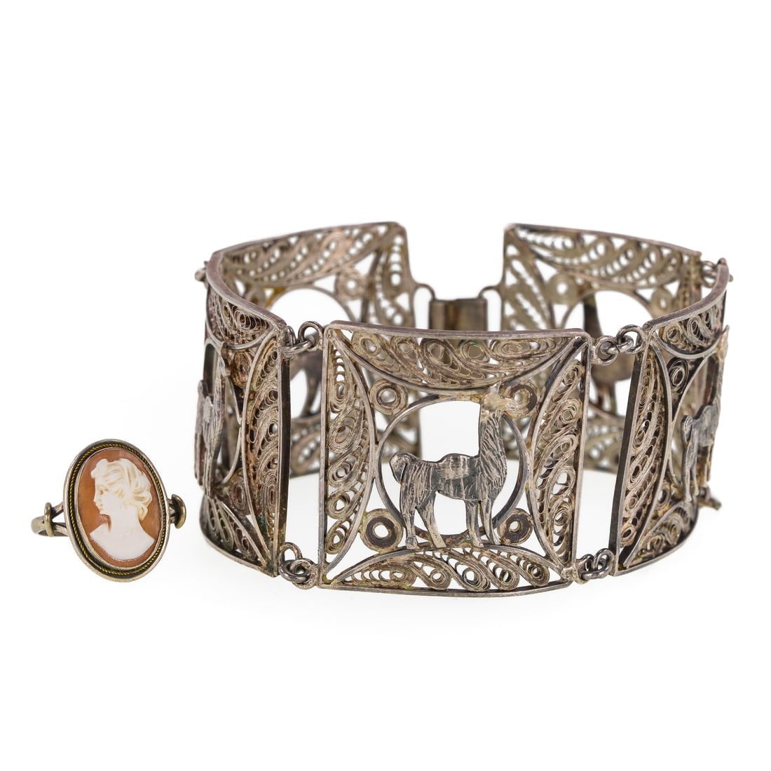 Peru Silver Bracelet & Cameo Ring: Sterling silver Peru 5 section bracelet with each section having a center lama and open work surround. 7" long, 1 1/4" wide. One section needs connection repair. With a Victorian sterling cameo ring,