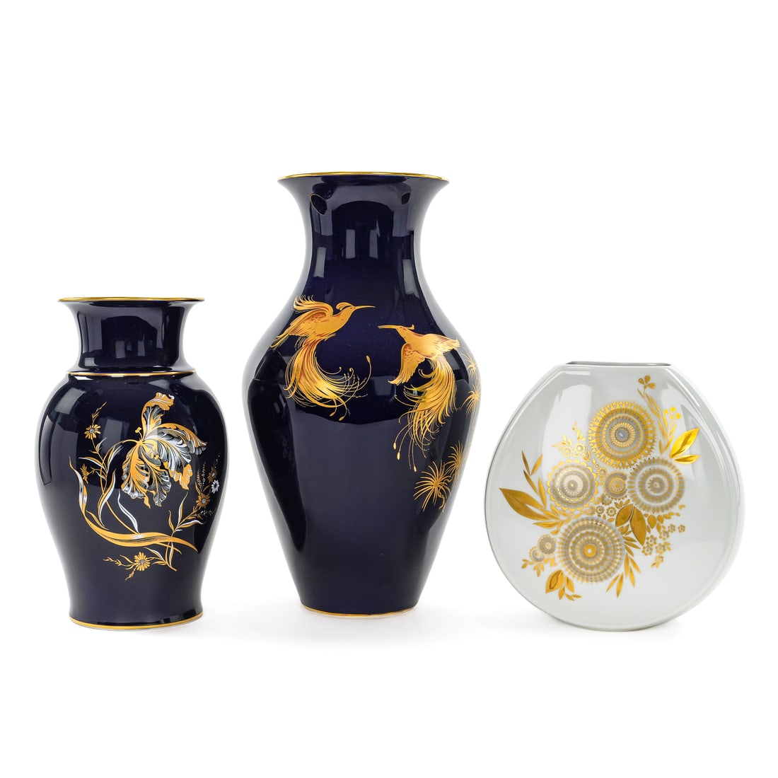 3 German Mid Century Porcelain Vases: 3 German Mid Century vases including Hutschenreuther canteen form vases with geometric floral motif, a Hutschenreuther cobalt vase with gilt birds of paradise, and a PMR vase with iris floral decorati